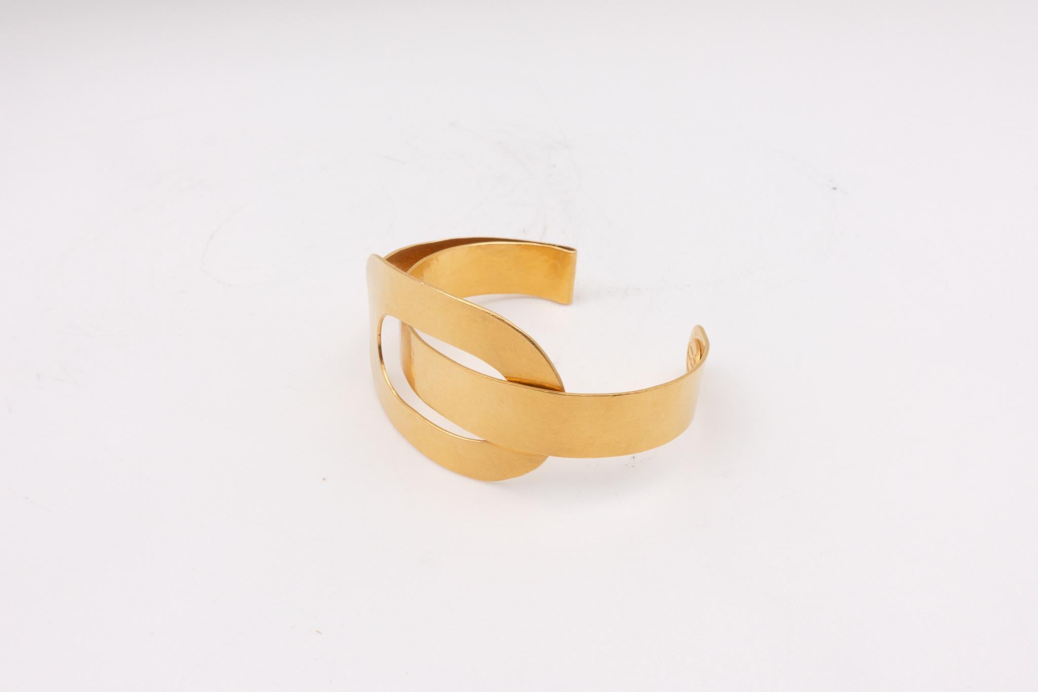 Highly collectable Herve Van Der Straeten hammered gold plated brass bracelet. Herve Van Der Straeten has discontinued making jewelry to focus more on his furniture line. His pieces have been collected the world over for decades. This is truly one