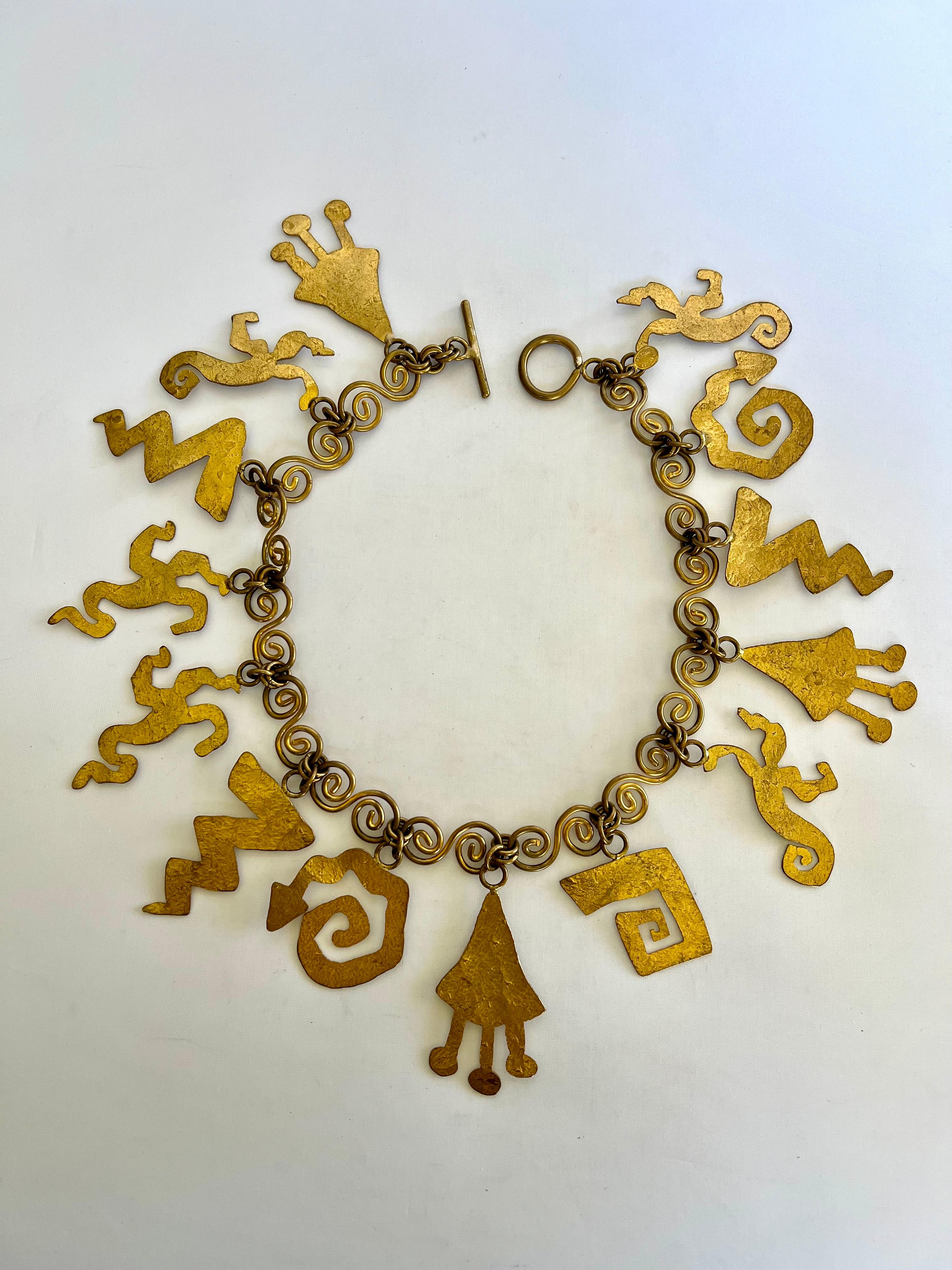 Scarce and collectible vintage artisan necklace comprised of gilt hammered metal 