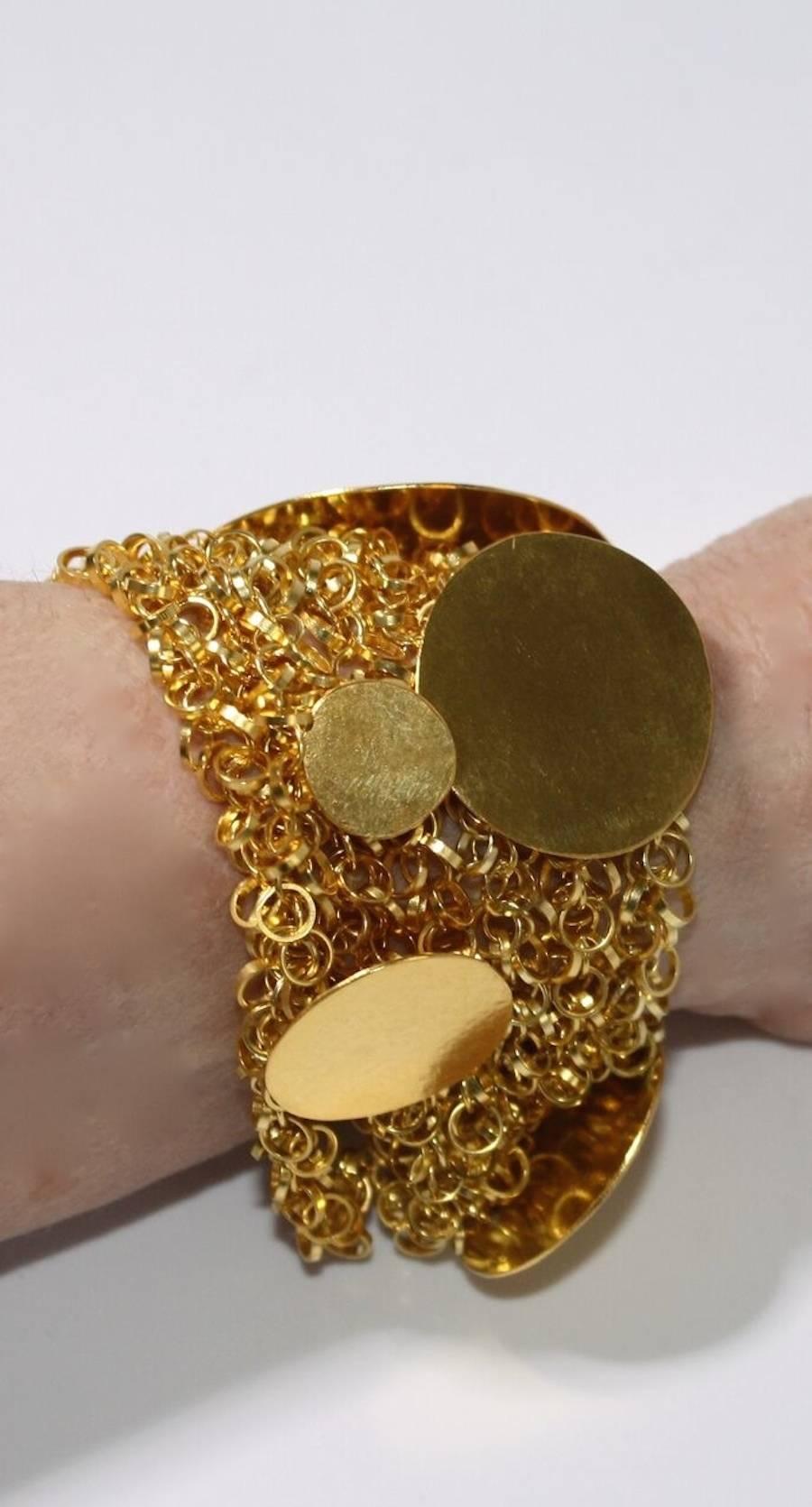 A unique multi chain gilded brass bracelet from designer Herve van der Straeten. This designer is no longer producing jewelry, thus all remaining pieces are collector's items. 