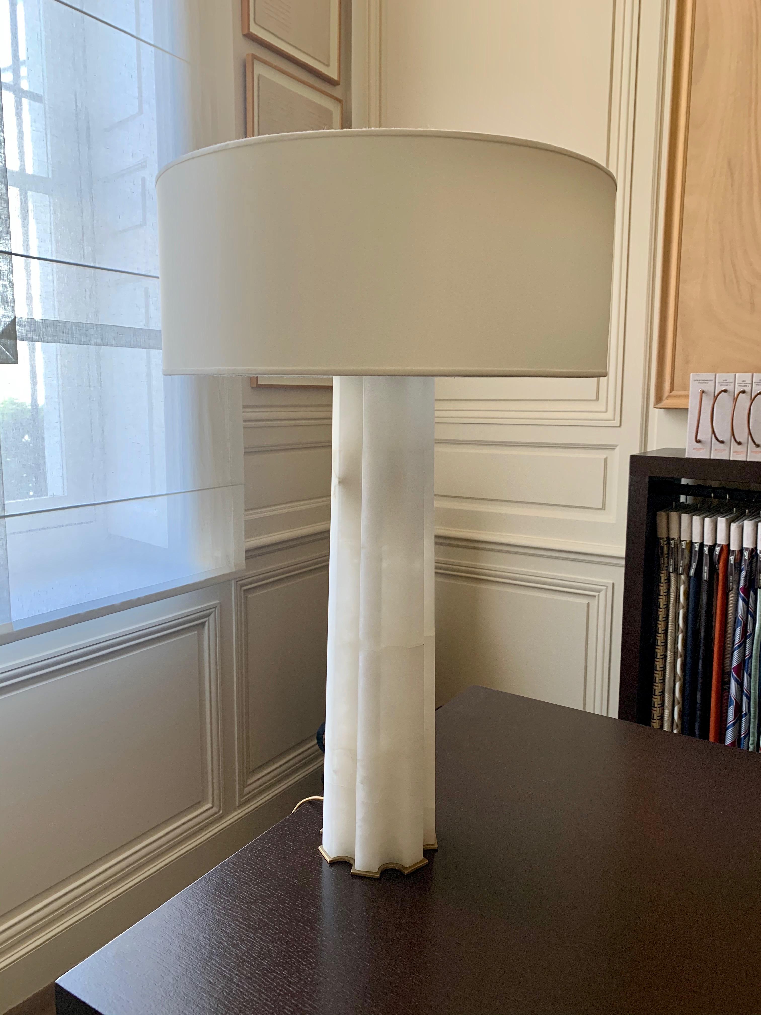 Beautiful pair of alabaster and gilded patinated bronze table lamps by Hervé Van Der Straeten. Off-white lampshade. 
This model was created in 2012. The lighting is two 60 W each. 

French designer Hervé Van der Straeten was born in 1965 and studied