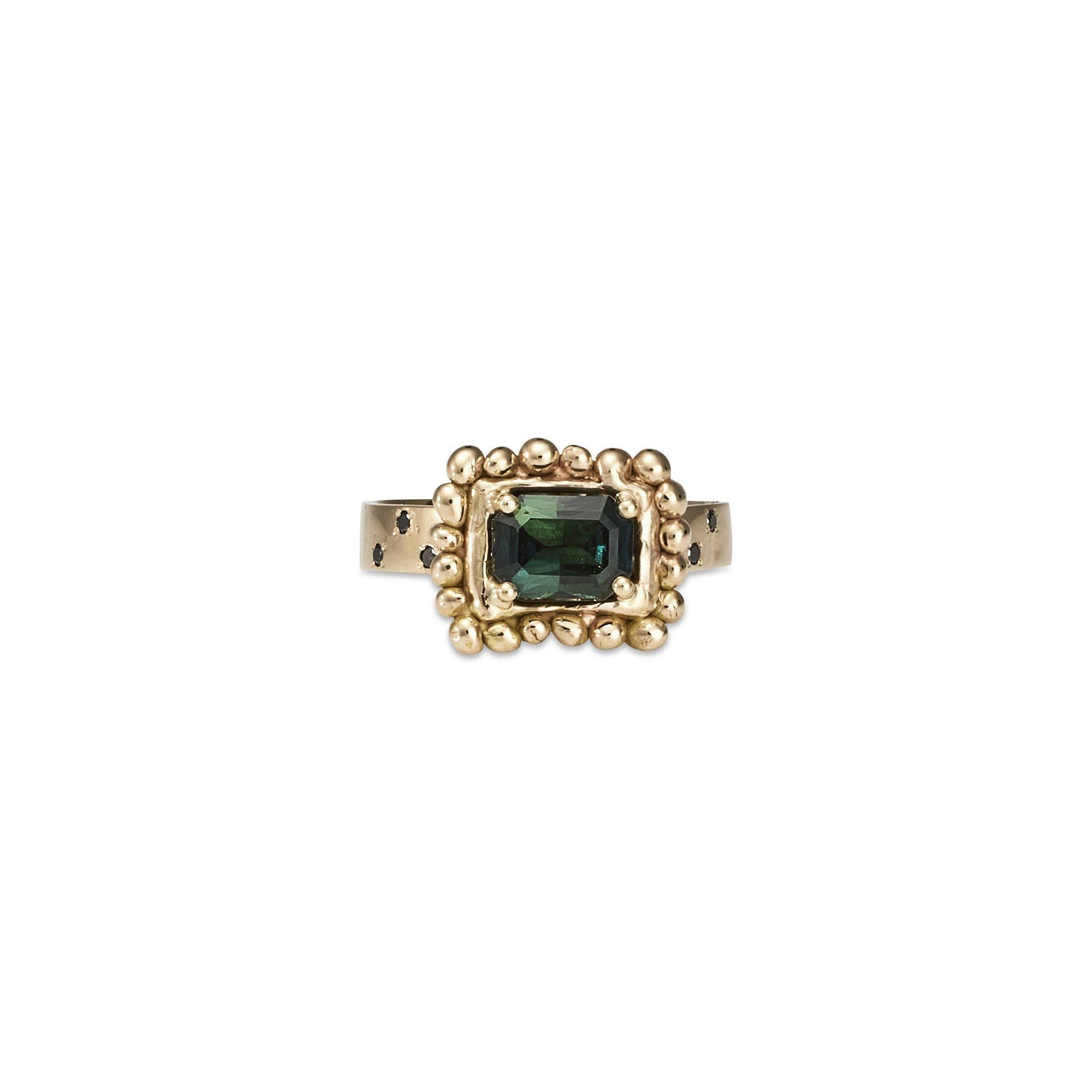 Hesper Ring, 18 Karat Yellow Gold with Australian Sapphire and Black Diamond
Handcrafted and individually cast in solid gold. Olivia carves each piece from wax, making these items unique, which we believe is what gives them their beauty. The Hesper