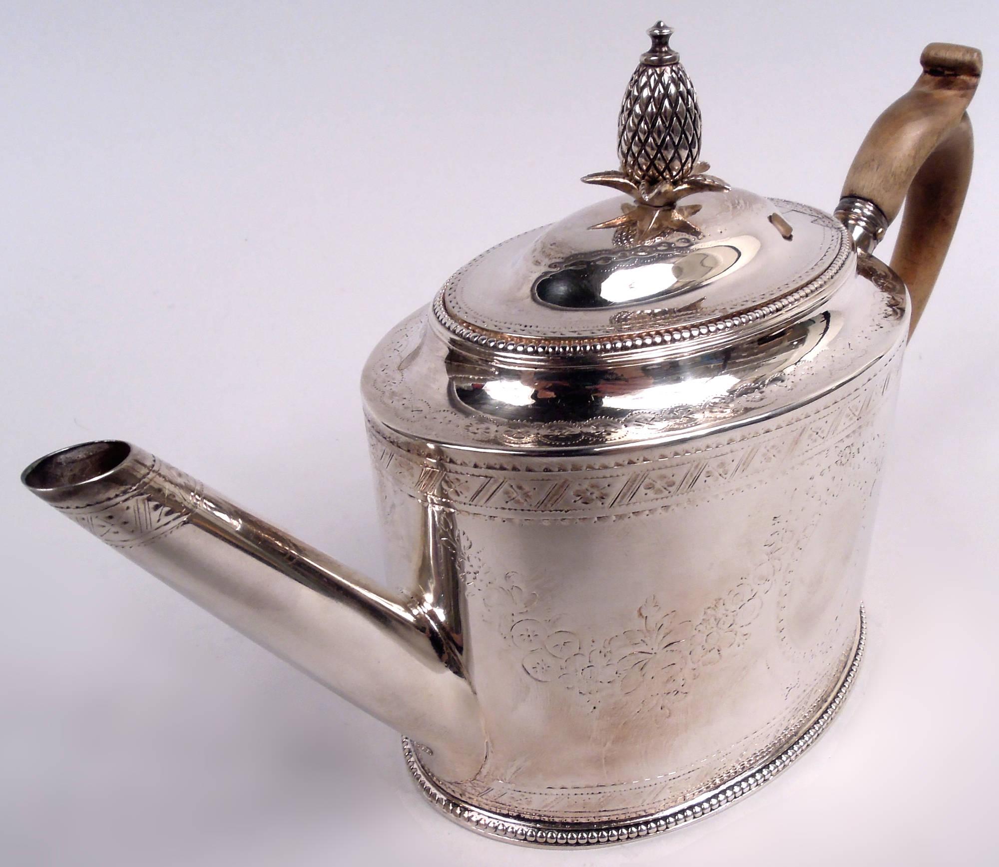 George III sterling silver teapot. Made by Hester Bateman in London in 1780. Oval body with straight diagonal spout and capped and high-looping stained-wood handle; cover hinged and domed with leaf-mounted pineapple finial. Engraved wraparound