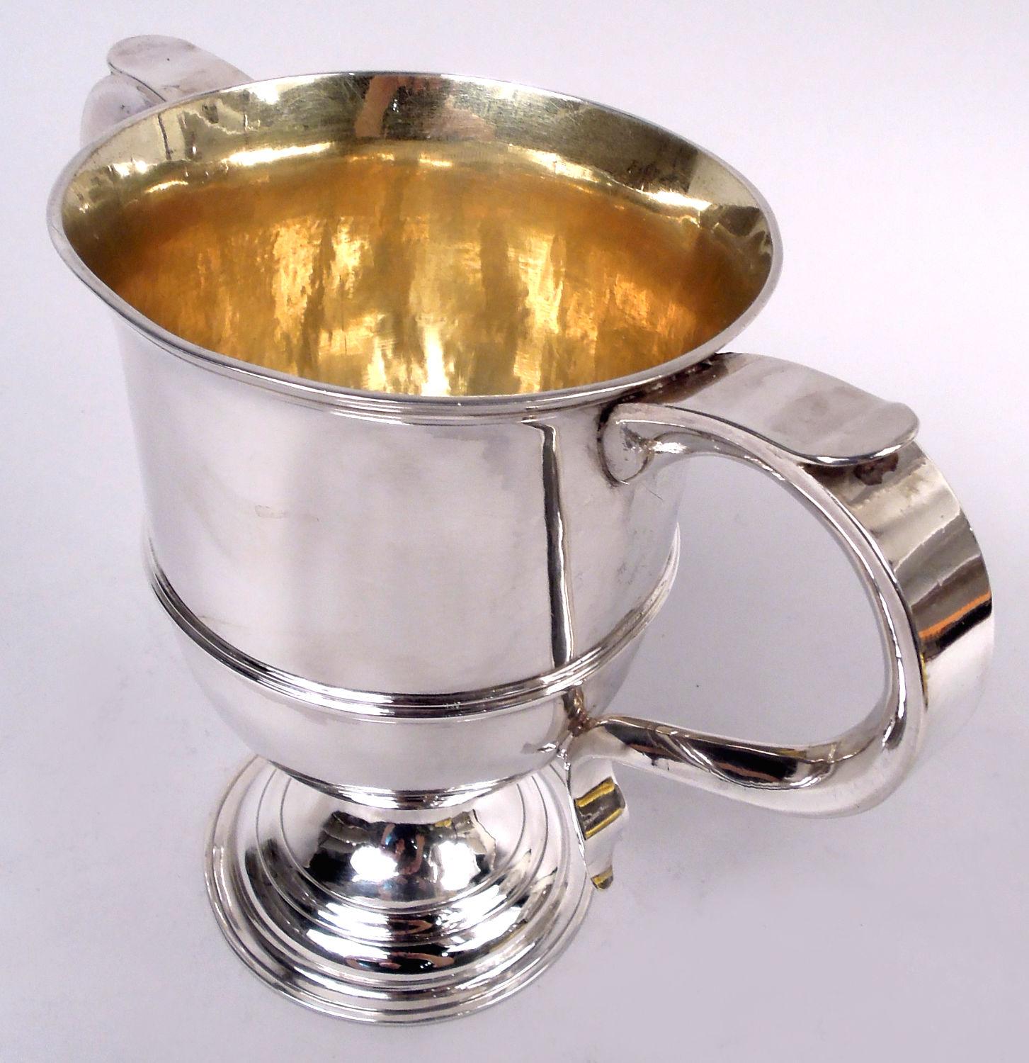 George III sterling silver urn. Made by Hester Bateman in London in 1785. Girdled bowl with flared rim and capped s-scroll side handles; domed foot. Gilt interior. Visible handwork. Formerly in the collection of the Minneapolis Institute of Art.