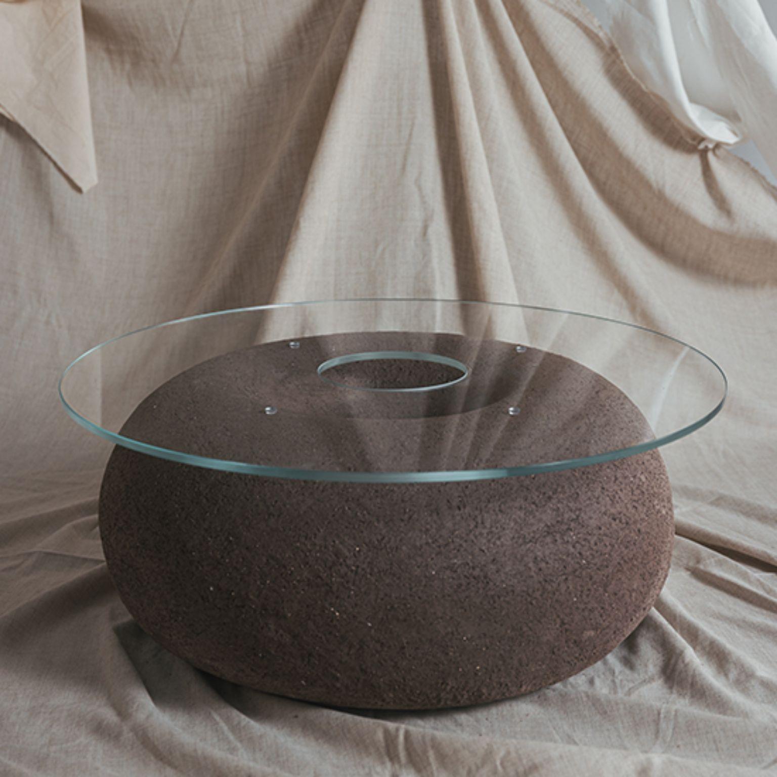 Hestia Coffee Table by Cuit Studio
One of a Kind.
Dimensions: Ø 80 x H 35 cm.
Materials: Textured black stoneware and tempered glass.

Sculptural coffee table. Black stoneware volcanic finish with 10mm extraclear tempered glass. Handmade in