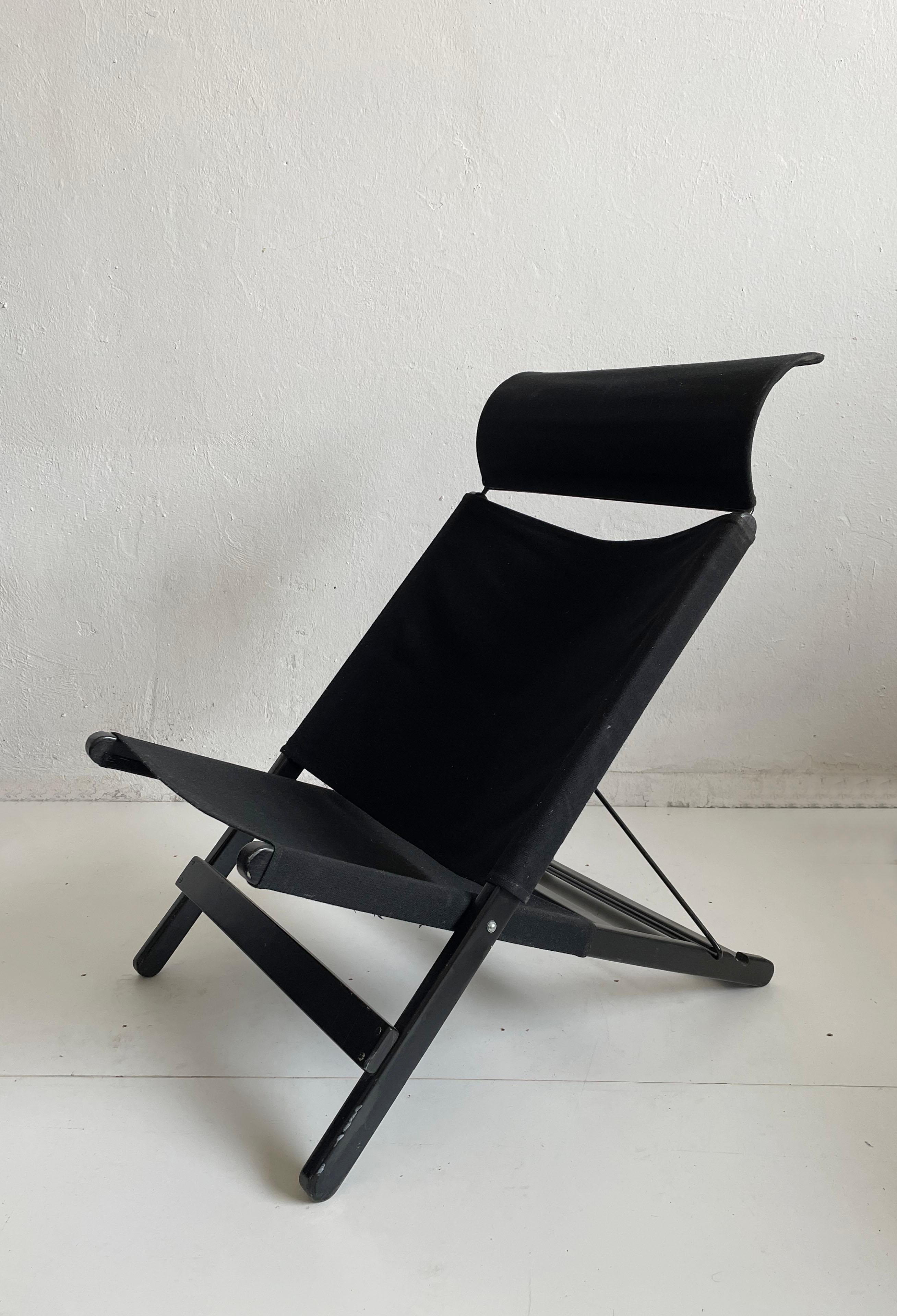 Vintage Hestra folding chair designed by Tord Bjorklund for Ikea and produced in the late 1980s, early 1990s. 
The chair has an adjustable back (2 positions) and a removable headrest. The frame is made of black lacquered wood and the seating is
