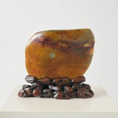 Hetian Jade Boulder on Carved Wooden Stand