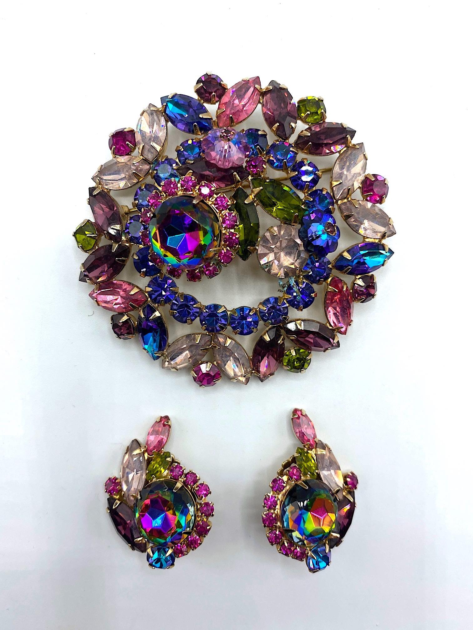 A stunning and impressive 1950s brooch and earring set by famous American designer of the early and mid 20th century Hattie Carnegie. The brooch is large 2.75 inches in diameter, lightly domed and .88 of an inch deep at the highest point. Each clip