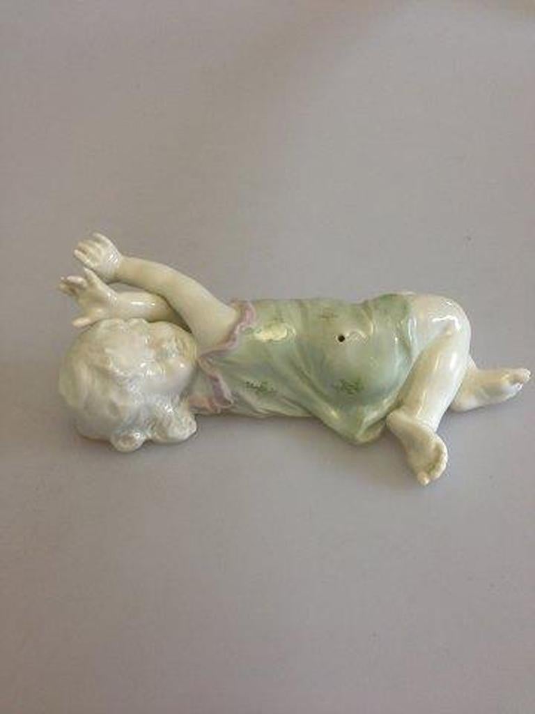 Heuback figurine of young girl. Piano figurine.

Measures 16cm / 6 3/10