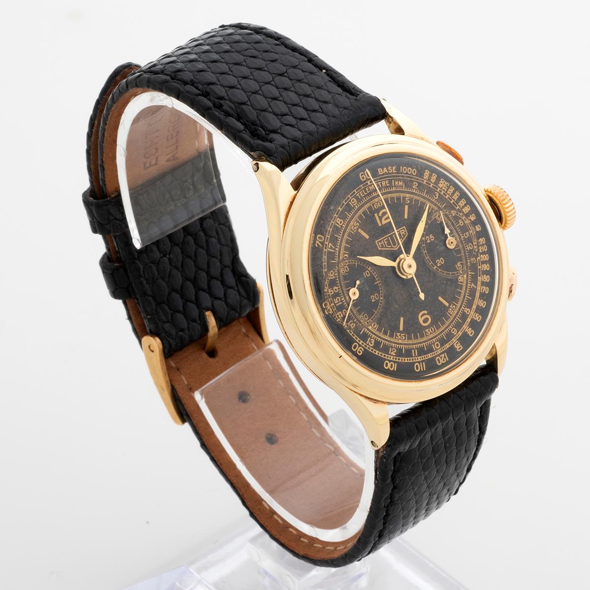 Our vintage Heuer chronograph reference features a 14k yellow gold Swiss case of 32.7mm (34.9 inc crown) by 38mm lug to lug. The dial is an attractive tropically patinated black with gold tone scales and sub dials, featuring tachymetre and telemetre