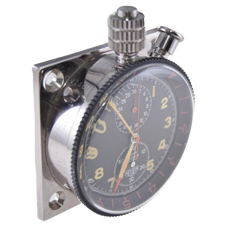 FACTORY / HOUSE: TAG Heuer Watch Company
STYLE / REFERENCE: Car Rally Clock 
METAL / MATERIAL: Chrome 
CIRCA / YEAR: 1960's
DIMENSIONS / SIZE: 2 Inch X 2 Inch
MOVEMENT / CALIBER: Heuer 
DIAL / HANDS: Original Dial and Hands 
WARRANTY: 18 months on