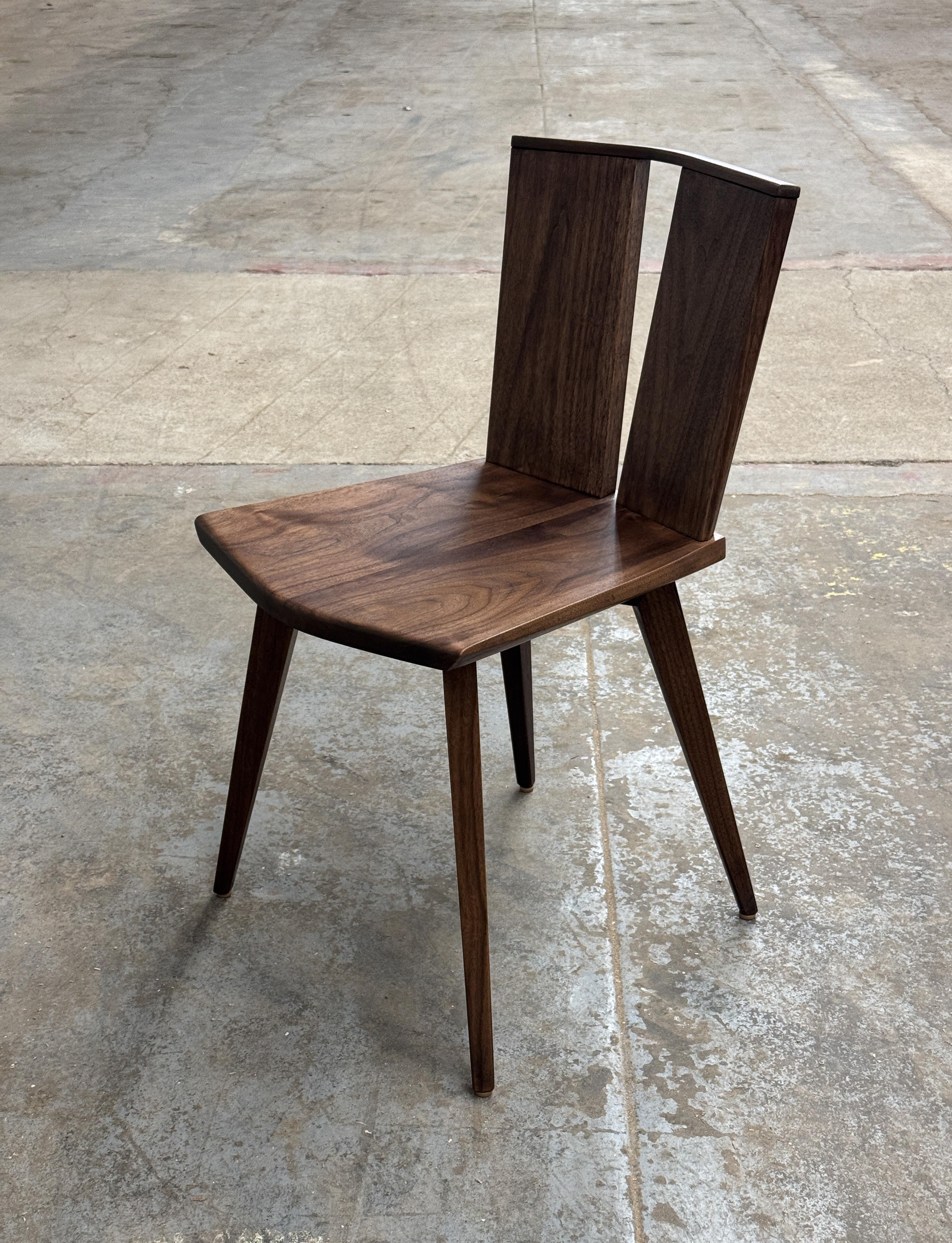 Contemporary lines with hand sculpted facets define this simple yet strong dining side chair. The sculpted slabs are inspired by the multitude of natural slabs that we select from to make our furniture.  
Every detail is worth appreciating.  Mortise