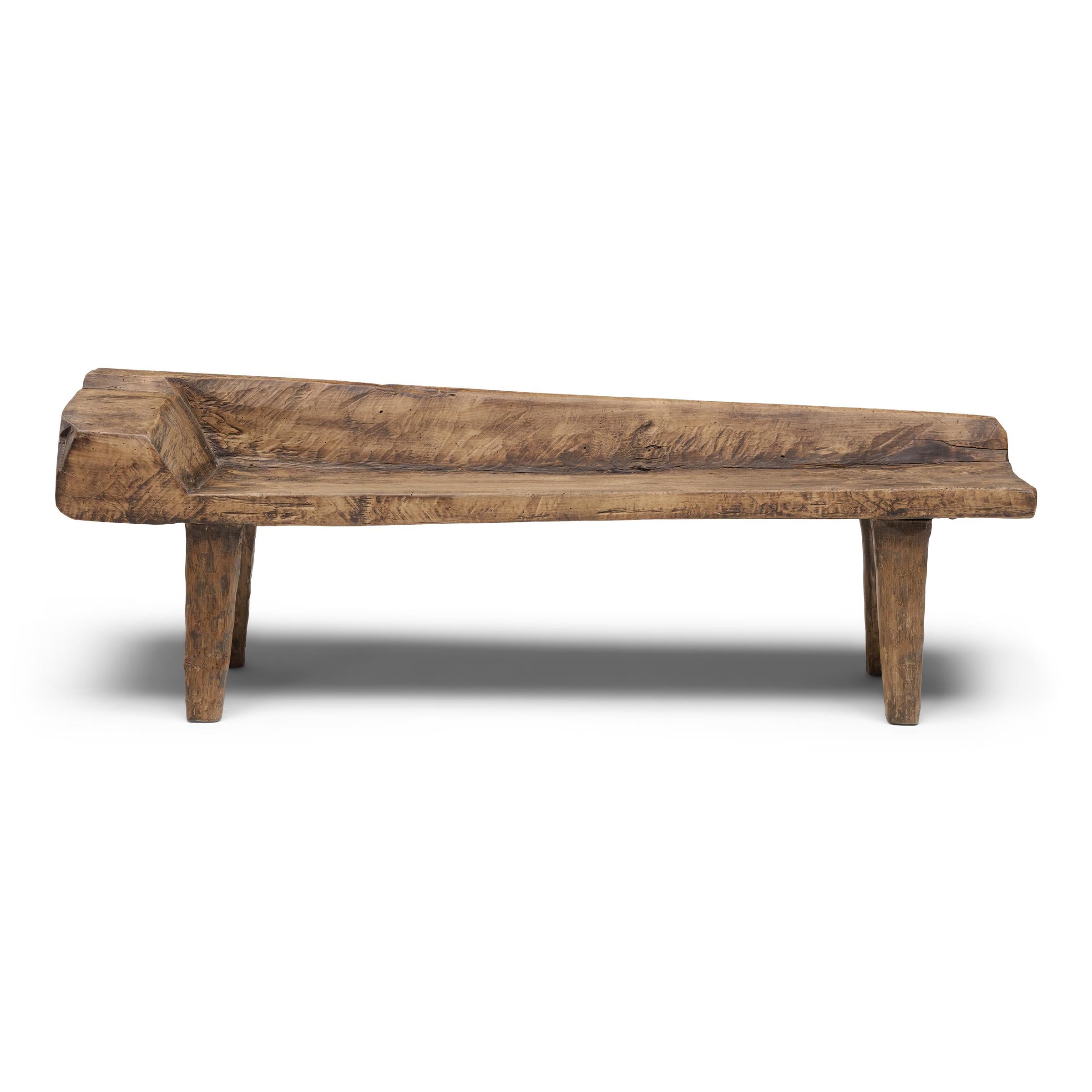 With freeform shape and incredible texture, this low courtyard bench from Shandong province embodies the spirit of wabi-sabi, the Japanese philosophy that beauty and integrity can be found within the imperfections of a timeworn object. The plank top