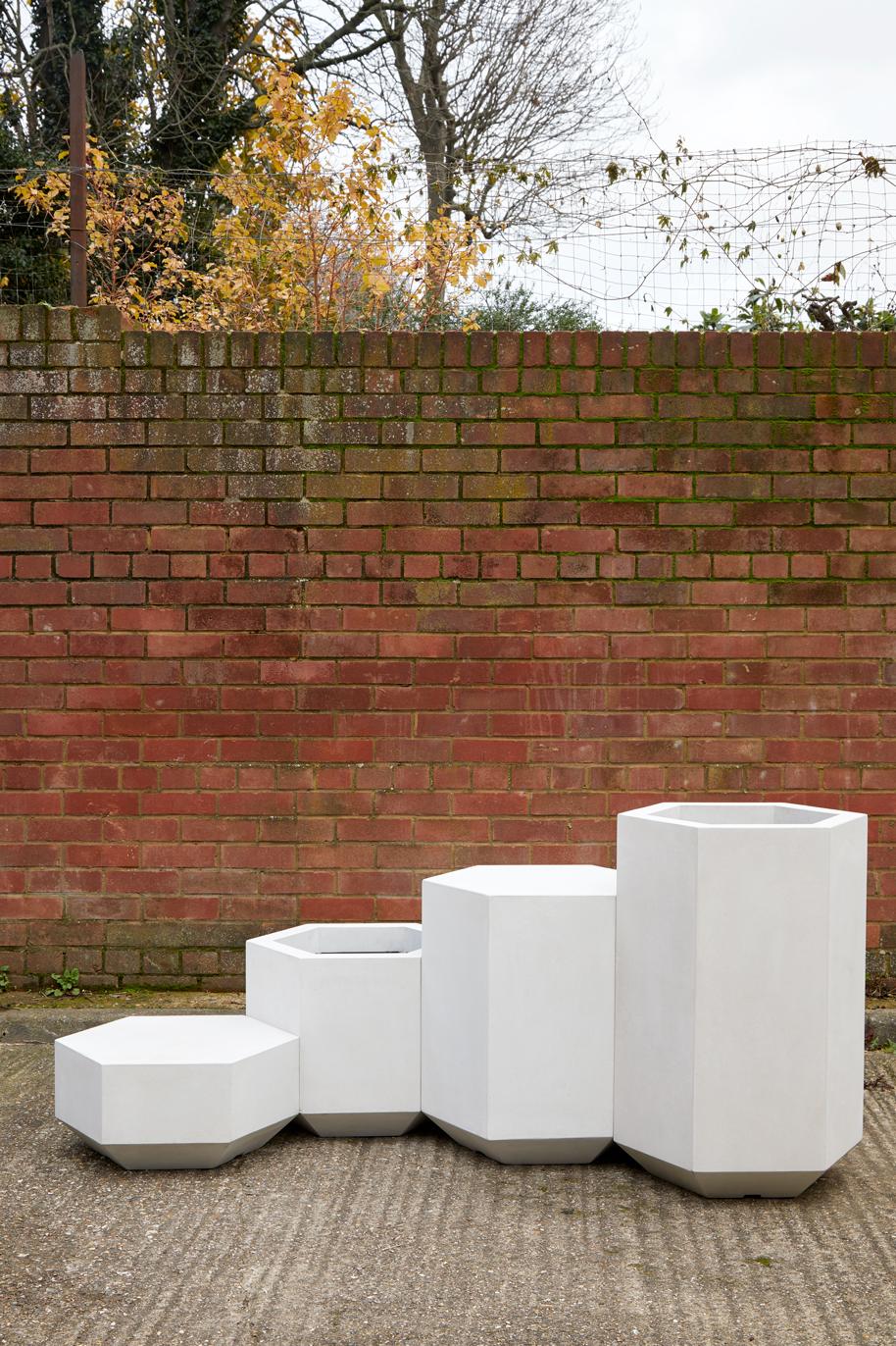 British Indoor or Outdoor Concrete Hex-Block table, 41cm tall For Sale