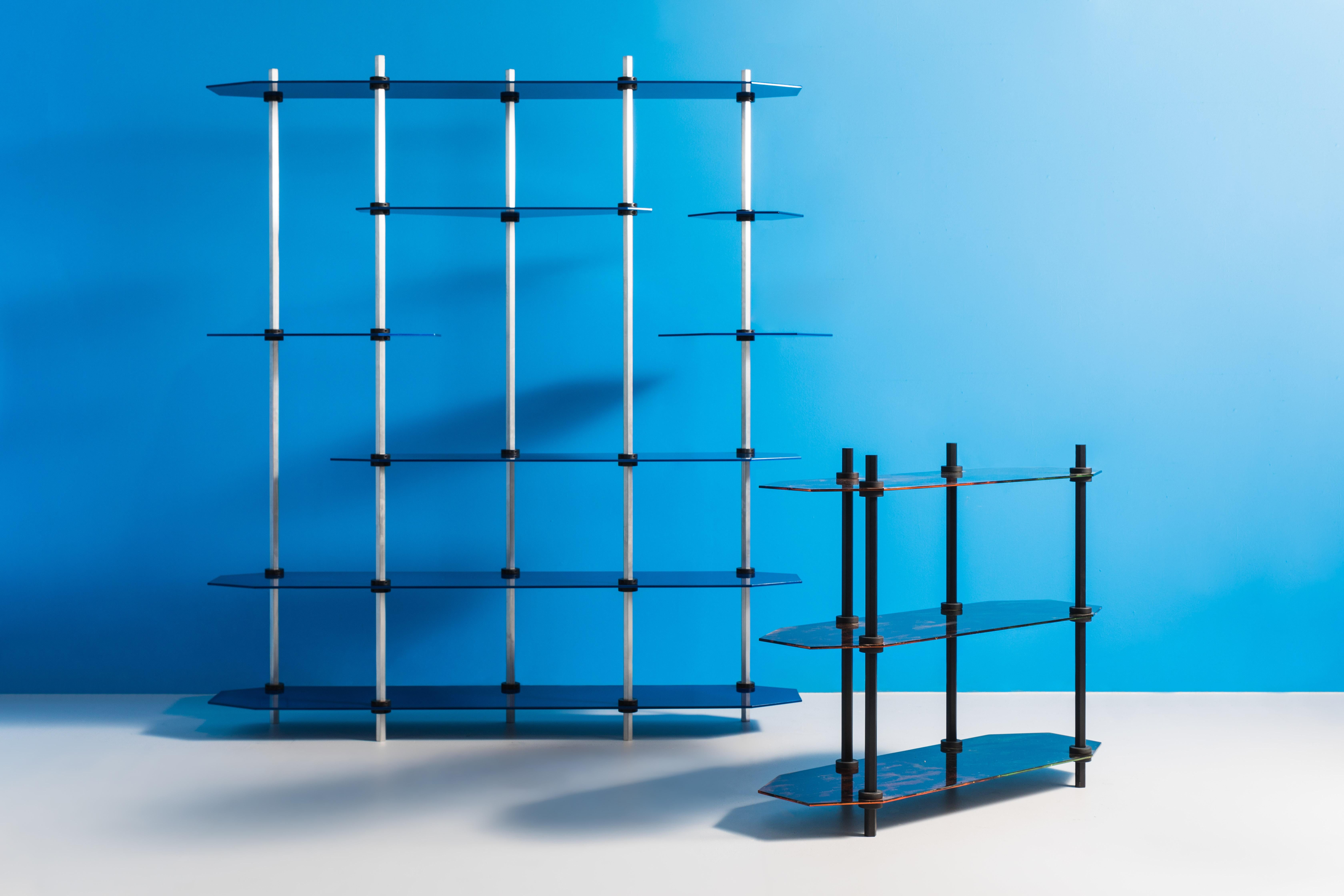 Hex Shelving is designed entirely around factory-made “shaft collars” which clamp onto the posts to secure the shelves. This blend of the low fi with ultra-high levels of finish quality gives the piece it's compelling uniqueness. 

A wide variety