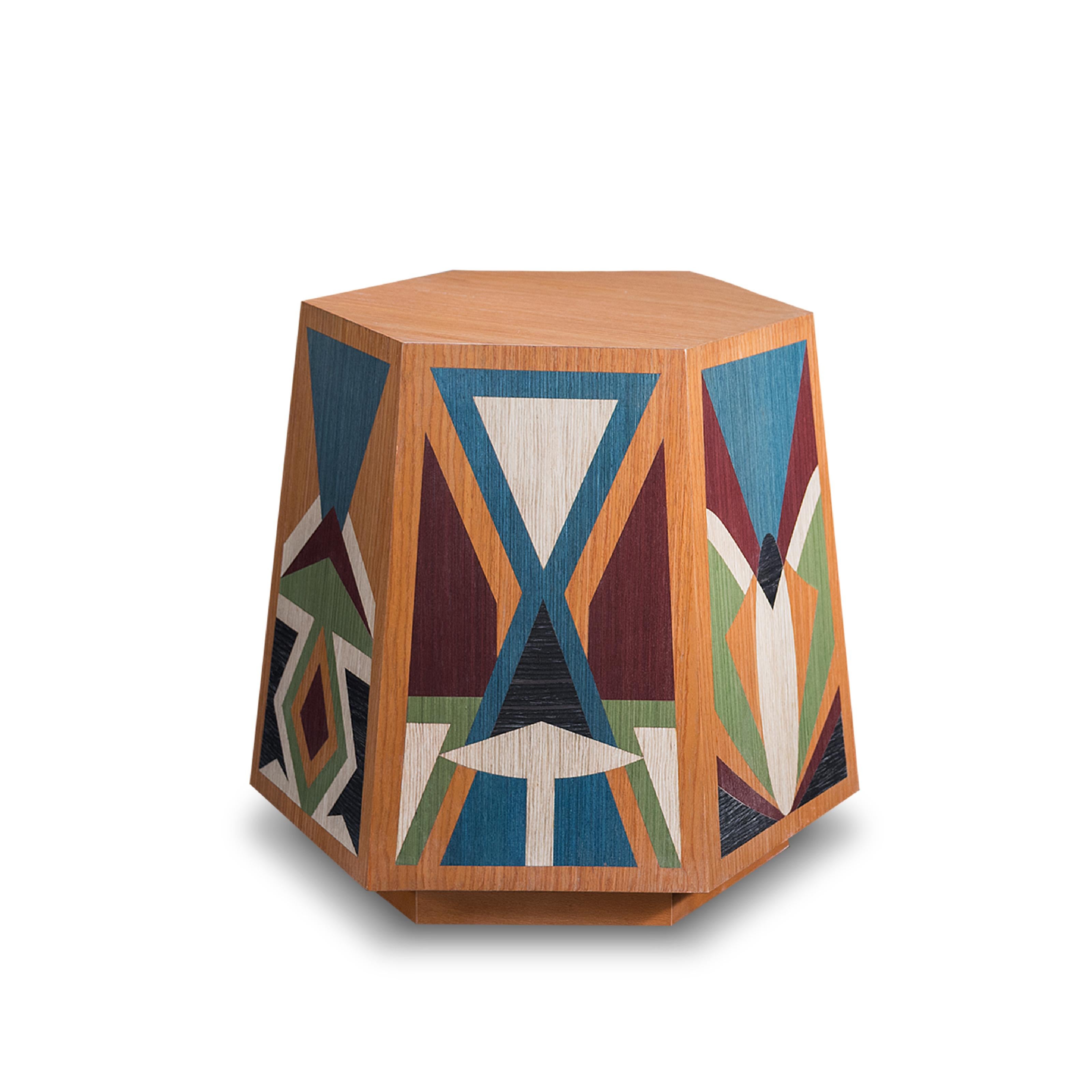 The hexagonal stool draws inspiration from Karim Ataya's intricate Islamic patterns, embodying geometric elegance and spiritual symbolism. Meticulously crafted patterns adorn each side, creating a harmonious balance and reﬂecting the principles of