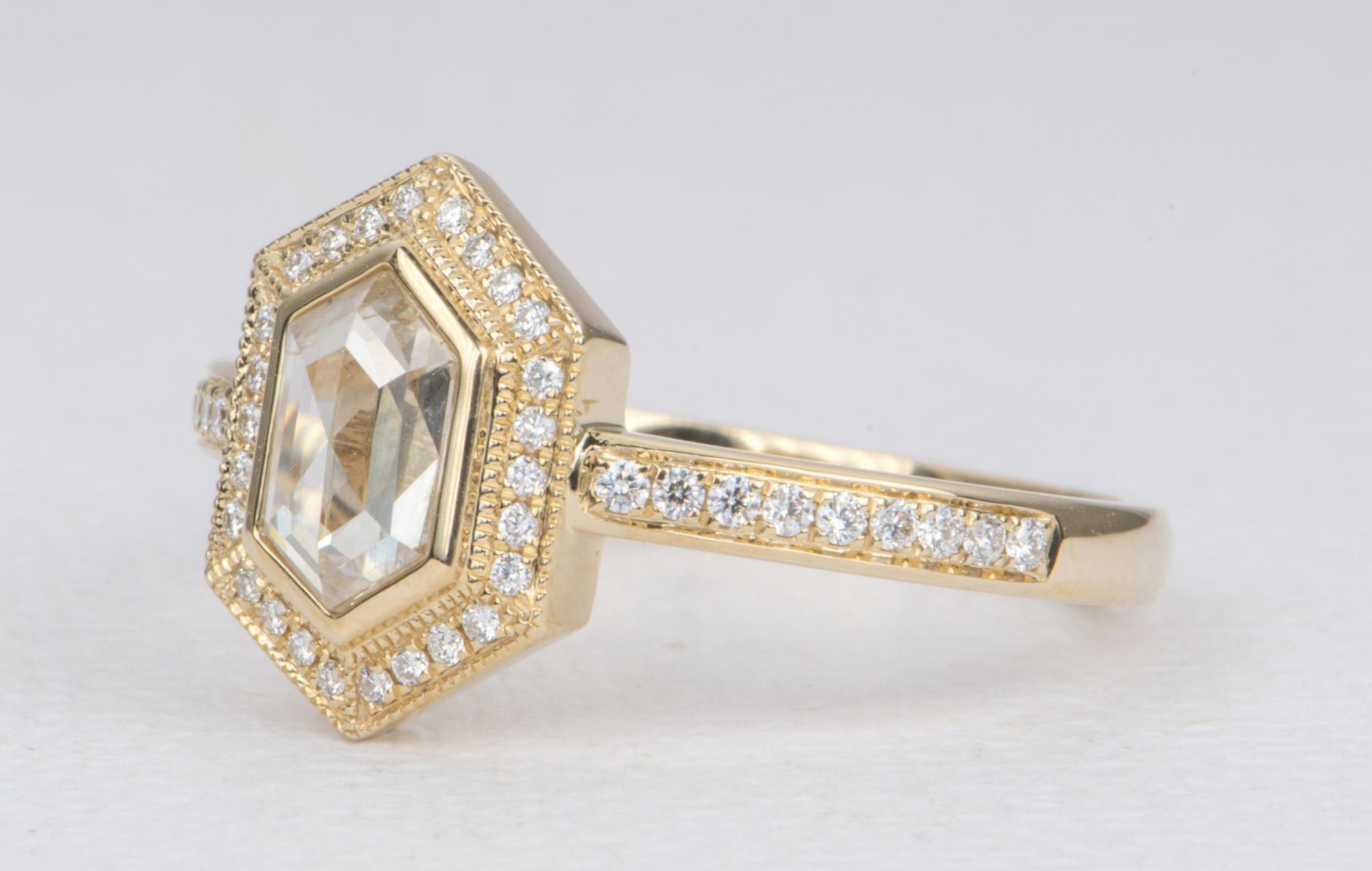 ♥  Solid 14K gold ring set with a hexagon-shaped diamond in the center in a bezel set style, then surrounded by a halo of brilliant colorless diamonds with delicate milgrain details.
♥  The diamond is very clear and almost eye-clean. It has a faint