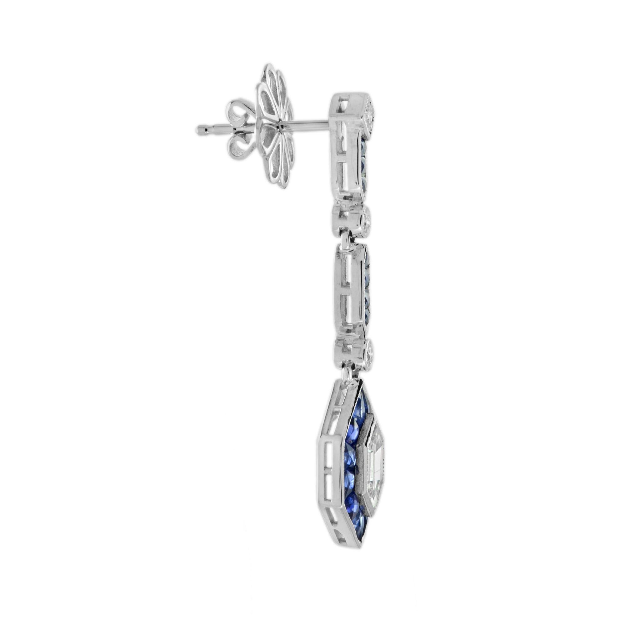 These Art Deco inspired drop earrings features 0.87 carats of total diamonds and 2.75 blue sapphires finished in a dazzling white gold setting. Both glamorous and imaginative, these drop earrings could be the show stopper addition to your jewelry