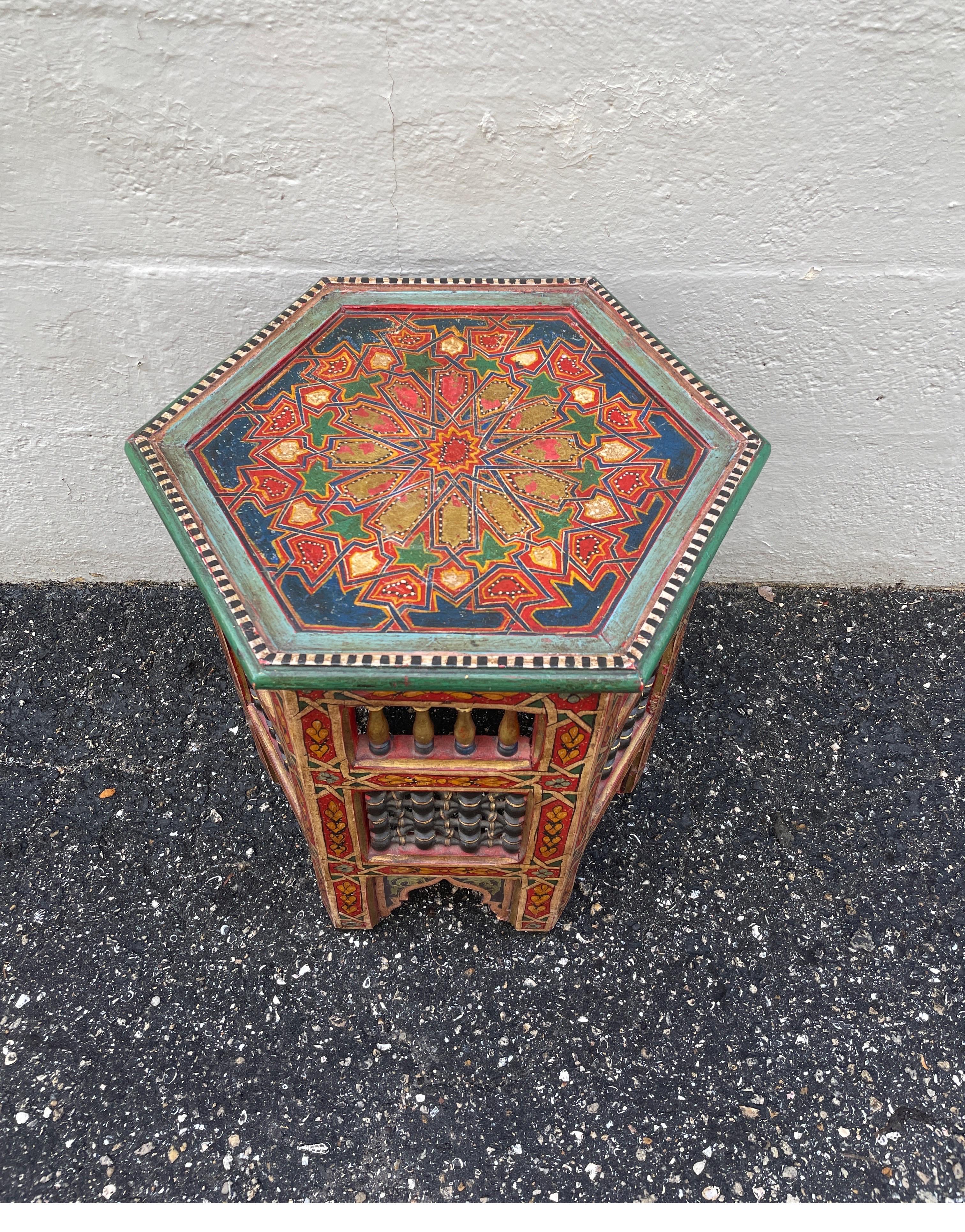 Very colorful Moroccan side table with intricate detail & attention to design. Beautiful hand painted mosaic design on top & sides.