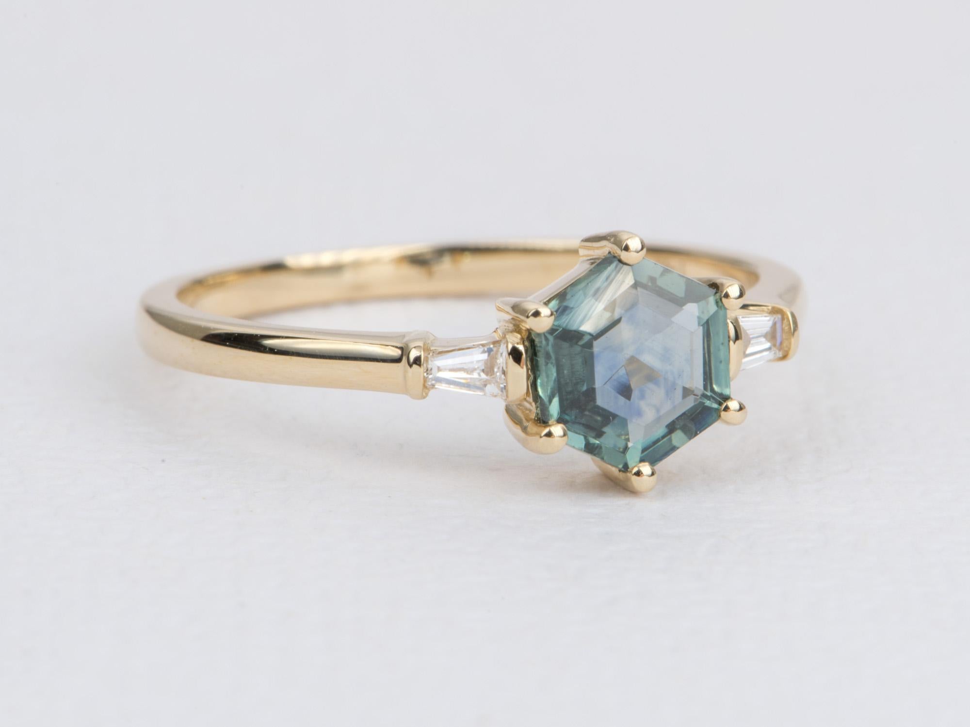 ♥  This modern ring has a hexagon-shaped Montana sapphire in the center, flanked by tapered baguette diamond on each side.  

♥  US Size 8 (Free resizing)
♥  Band width: 1.7mm
♥  Material: 14K yellow gold
♥  Gemstones: Montana sapphire, 0.99ct;