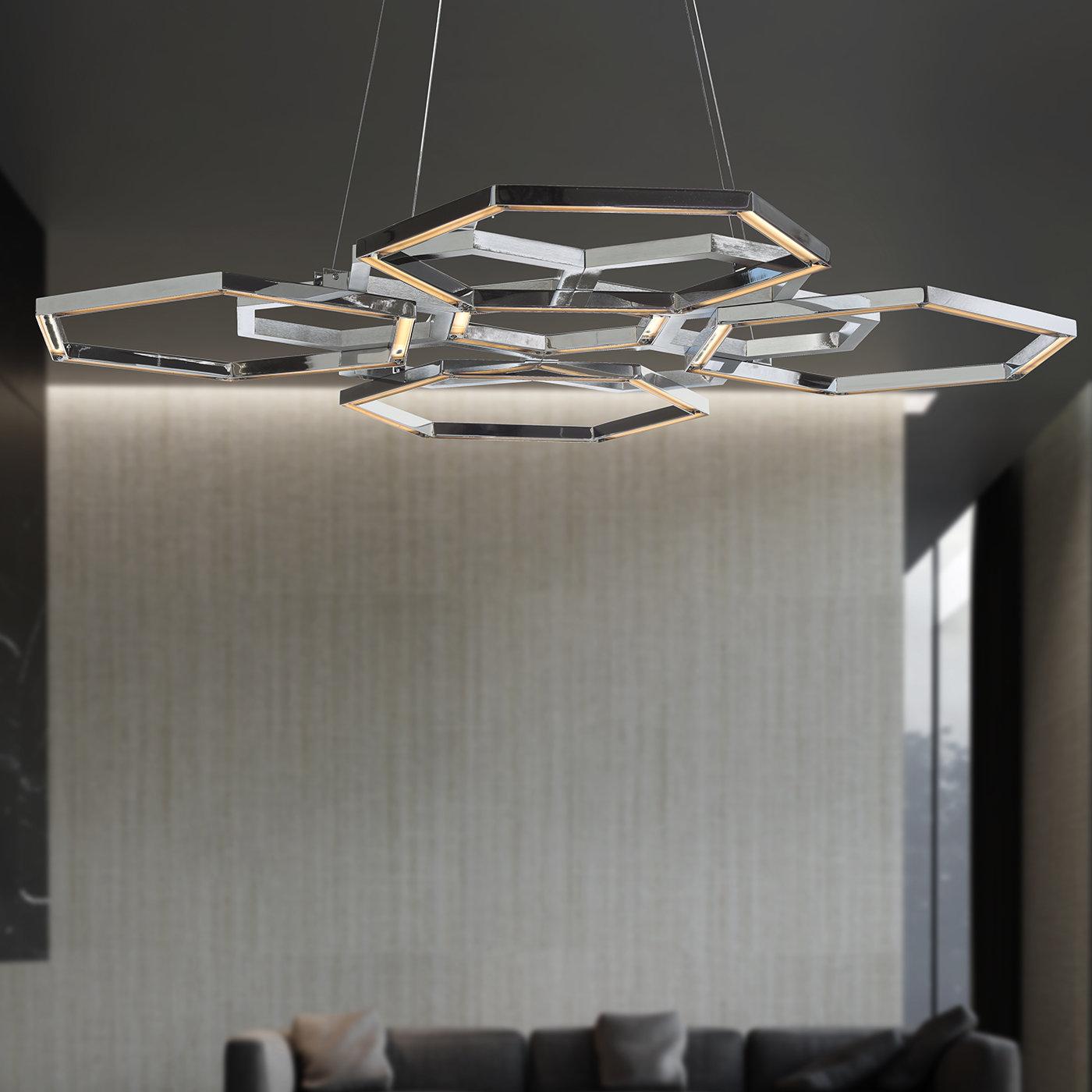 Adding a strong visual impact in a contemporary interior, this chandelier boasts a low-profile silhouette composed of small and large hexagons that create a captivating interplay of empty spaces. The ideal statement piece to complement contemporary