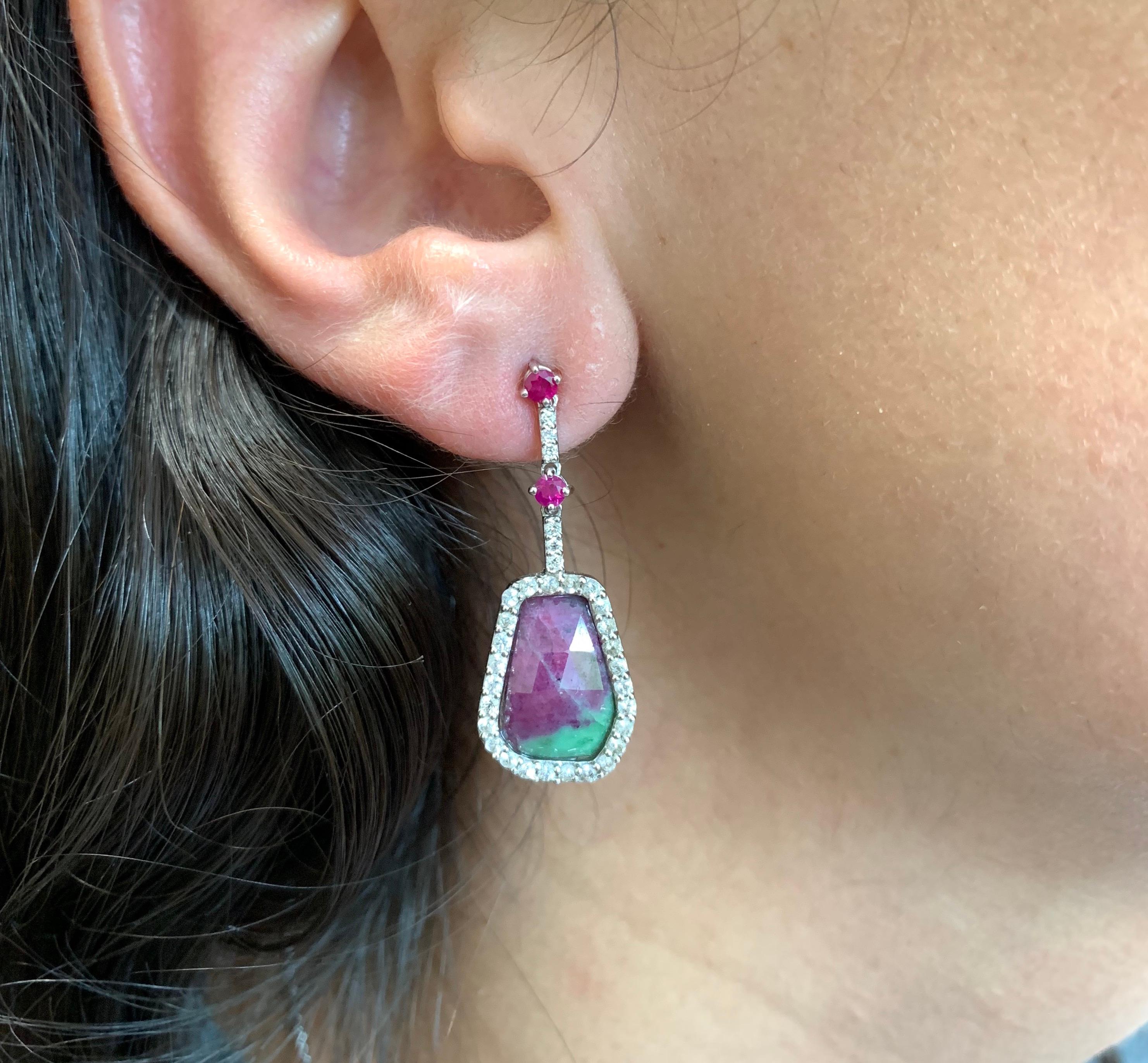 Material: 14k White Gold 
Center Stone Details: 2 Hexagon Shaped Ruby-Zoisites at 7.84 Carats Total - Measuring 12.8 x 9.4 mm
Stone Details: 4 Round Rubies at 0.32 Carats 
Stone Details: 54 Round White Sapphires at 0.77 Carats 
Diamond Details: 12