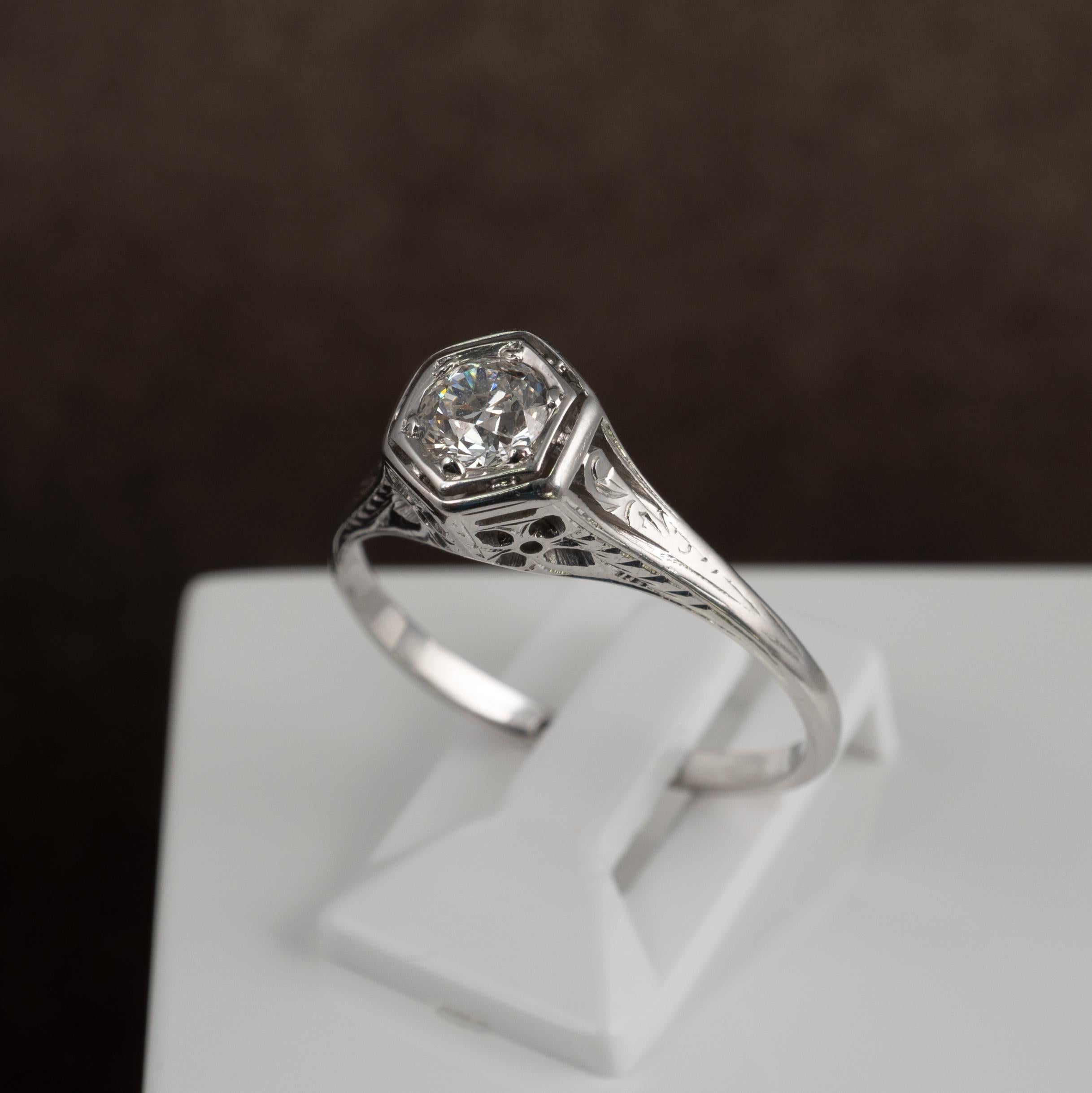 This exemplary Art Deco diamond solitaire, crafted beautifully in 18 karat white gold, is presented in fabulous condition. The hexagon shape setting is set with a VS1 quality 0.50ct old cut eye clean diamond that is truly outstanding. 

The setting