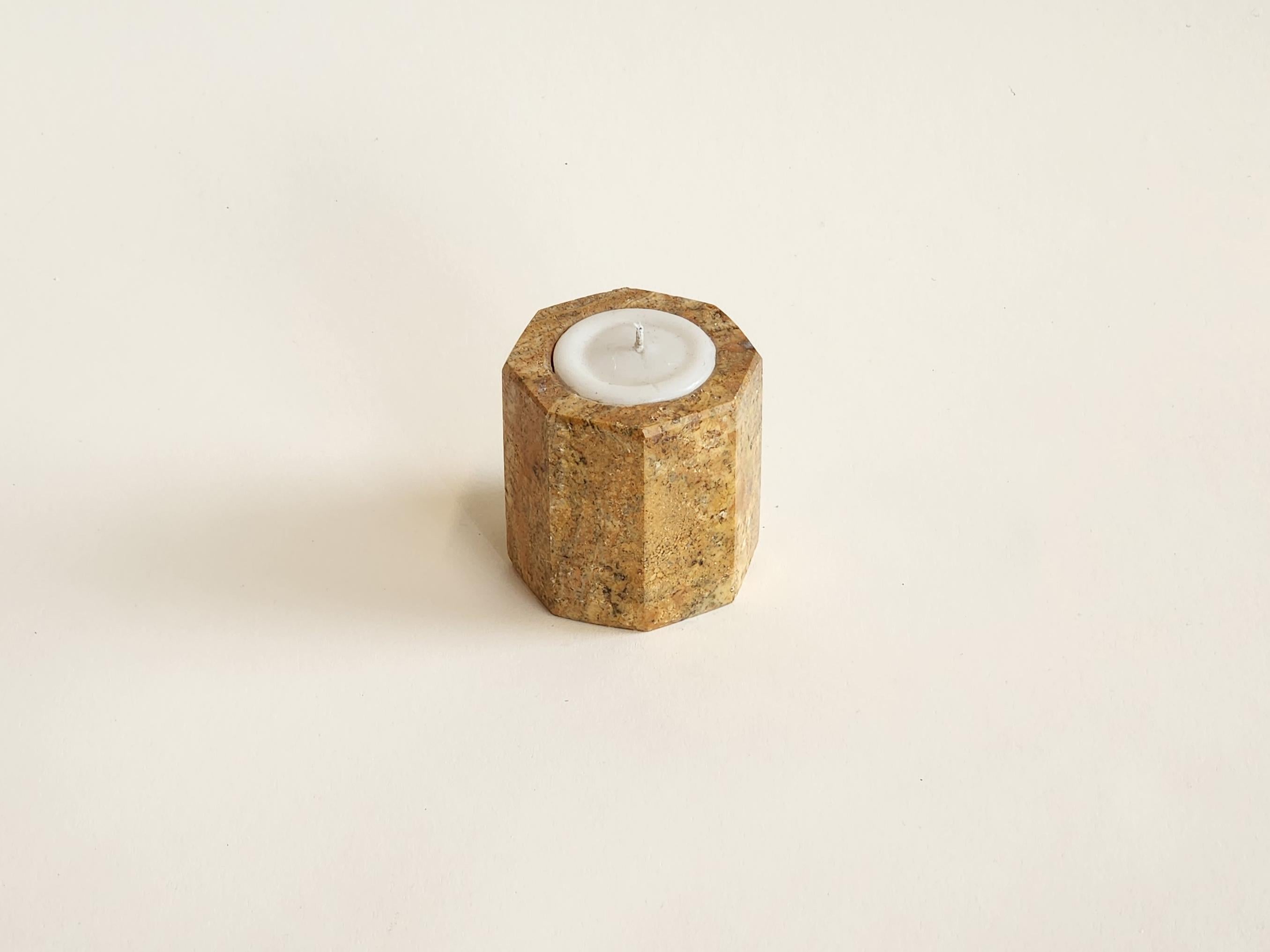 Manually carved hexagon shaped Onyx candle holder.