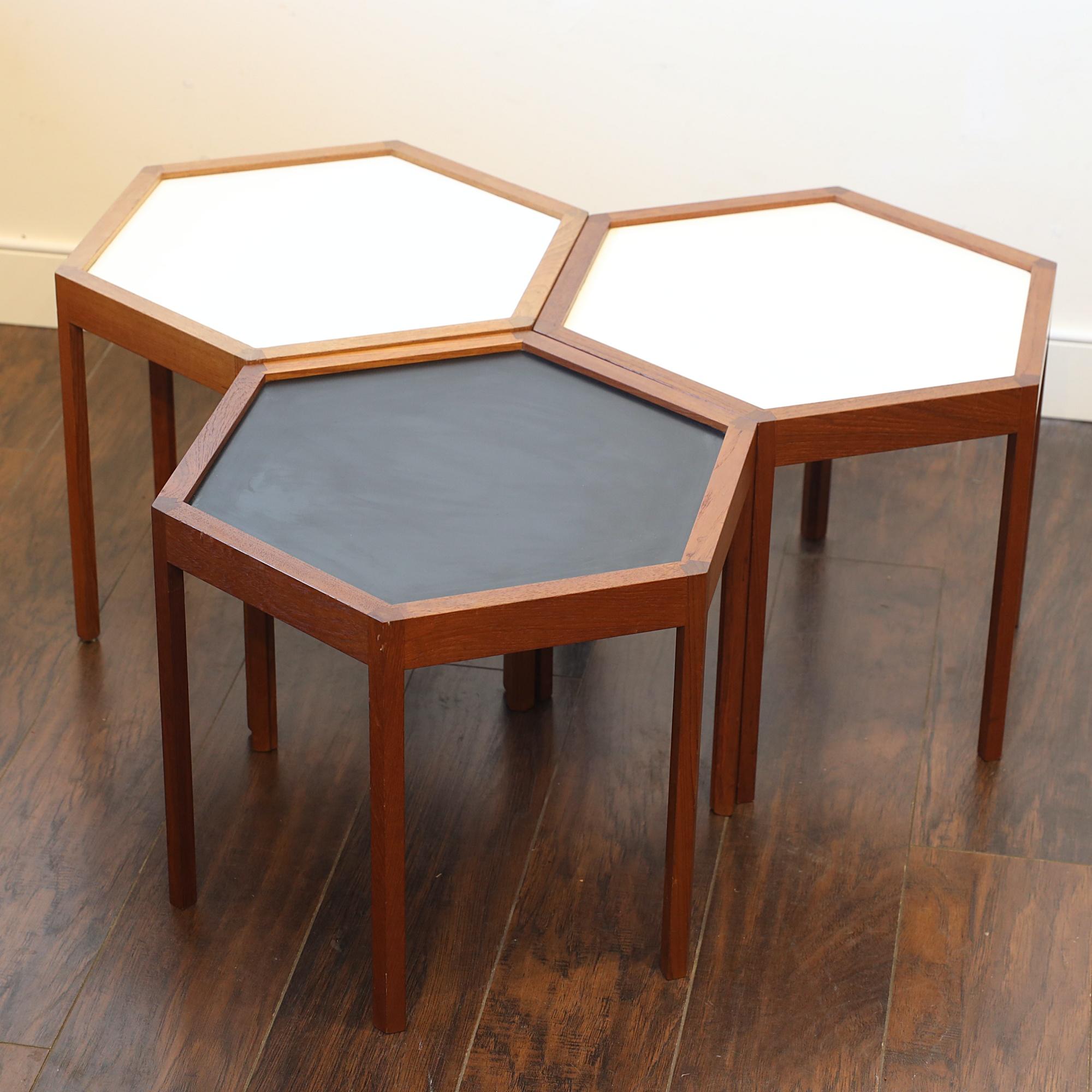 Rare Hexagon teak occasional tables Designed by Hans C. Andersen.
2 of tables are with white formica top and one in black.
Excellent detailing and craftsmanship and many of variation could be made.
1 long shape, all together round shape ore