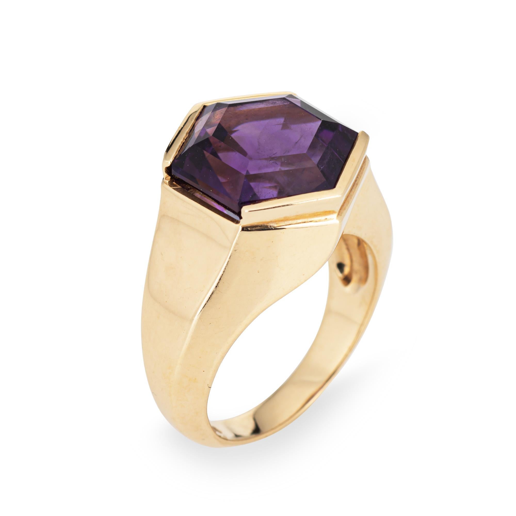 Vintage amethyst ring crafted in 14k yellow gold (circa 1980s).  

Hexagonal cut amethyst measures 13mm diameter. The amethyst is in very good condition and free of cracks or chips. 

The stylish hexagonal shaped ring makes a great statement on the
