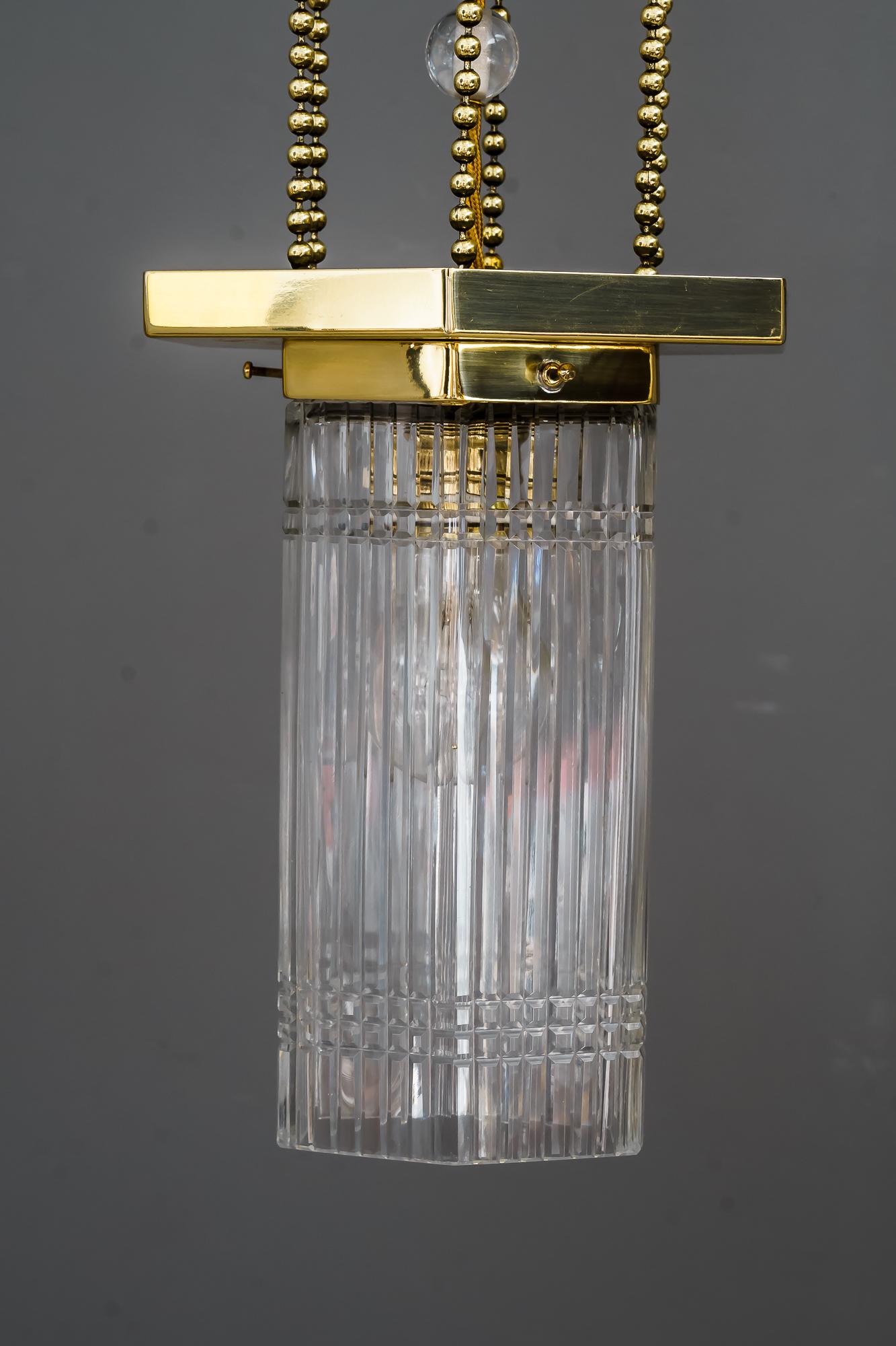 Hexagonal art deco pendant with original glass shade, around 1920s
Brass polished and stove enameled.