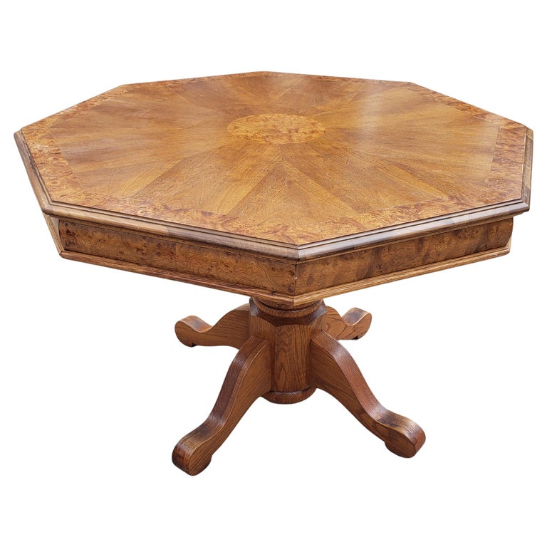 Exceptionally beautiful hexagonal pedestal dining table or center table in solid oak and burl, book matched walnut top. Quad legs oak pedestal. Walnut Burl book matched top with center medallion. Top screws off and on for easy handling and