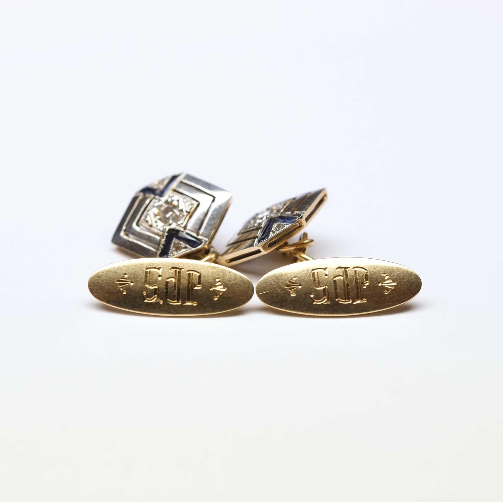 Deco period cufflinks (1920/30s), finely decorated and hand made set in gold and platinum. With rose cut diamonds and calibrated cut sapphires.

Highlights
- Deco period 1930s circa
- Decorated with rose cut diamonds and rubies
- Platinum and gold