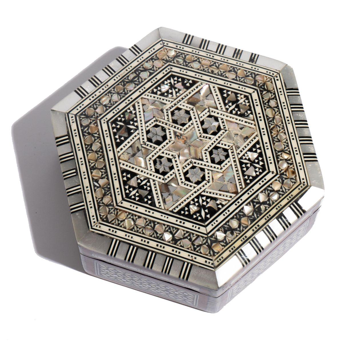 Hexagonal hardwood hinged lid box with mother of pearl, ebony, and abalone inlay centering on a six pointed star defined by stringing, patterned inlay, and banding.