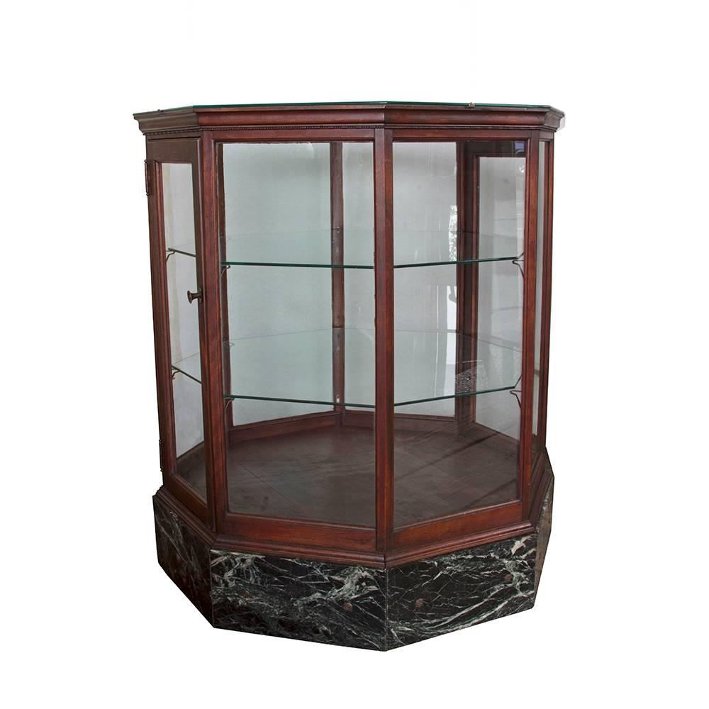 Nothing speaks to the elegance of bygone days quite like the genteel charm of these display cabinets. The unusual hexagonal shape allows for visual displays in the round and with the quality construction and fine materials. The green marble bases