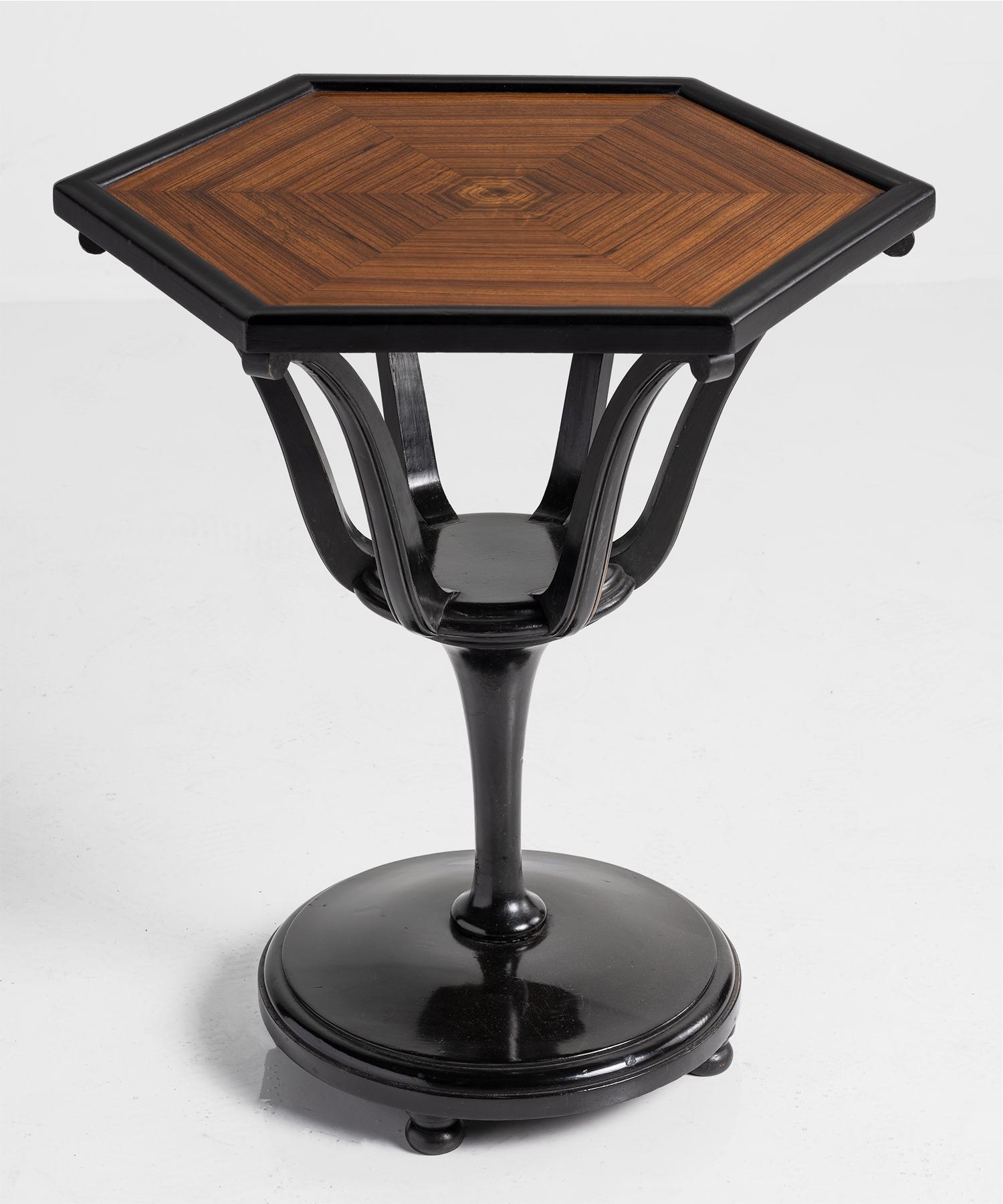 Hexagonal ebonized table, England, 20th century.

Art Deco occasional table with unique form.