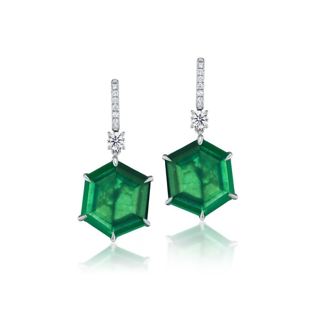 HEXAGONAL
EMERALD AND DIAMOND EARRINGS
These remarkable earrings feature hexagonal shaped deep green 29 ct
Emeralds surrounded by sparkling diamonds in a 18K white gold setting
Item: # 04073
Metal: 18k White Gold
Color Weight: 29.42 ct.
Diamond