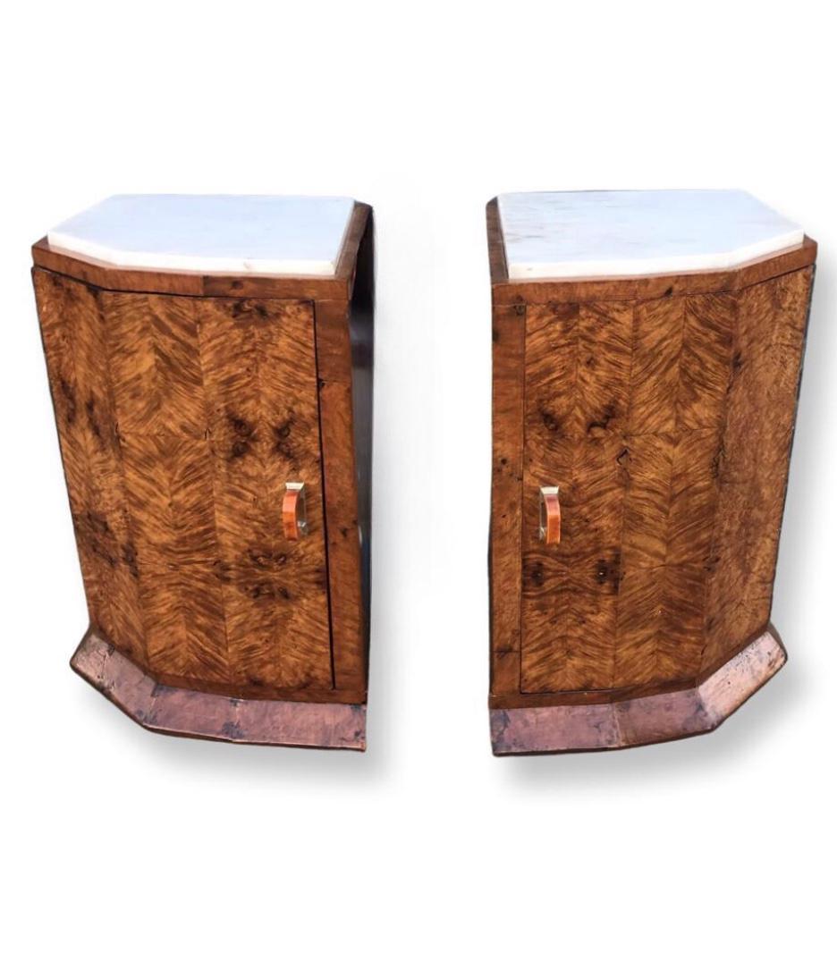 A beautiful pair of Art Deco nightstands/bedside cabinets dating to Circa 1930, these cabinets are in gorgeous figured walnut, a lovely warm tone. The original marble tops in very good condition sit neatly on the tops of these lovely cabinets. The