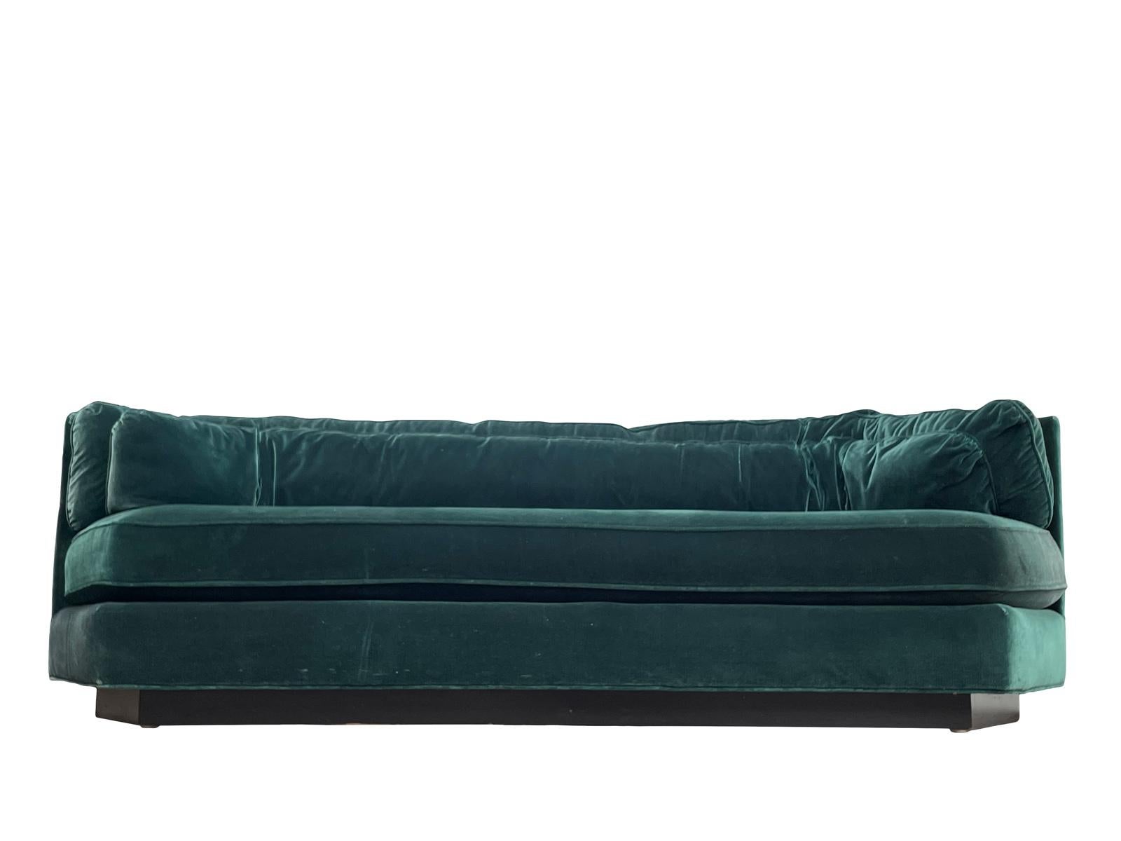 Luxurious hexagonal green velvet sofa in the manner of Milo Baughman by Bernhardt “Flair” with black plinth base. Also available are 2 matching club chairs and an exact sofa in different upholstery 