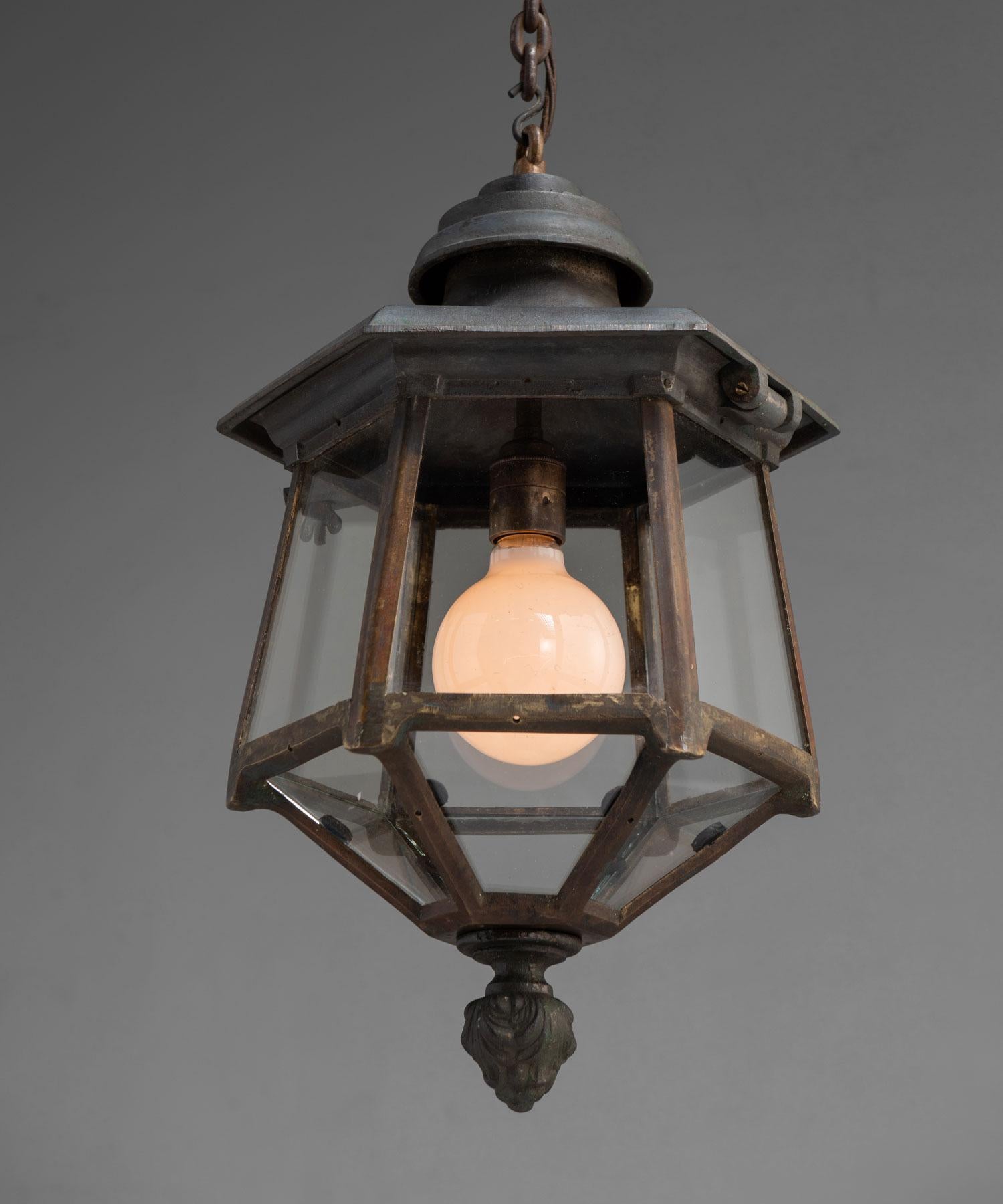 Hexagonal lantern, England, circa 1940.

Unique lantern made by Revo in the 1930s, with 18th century paged top and neoclassical finial with industrial construction in iron and brass.

 