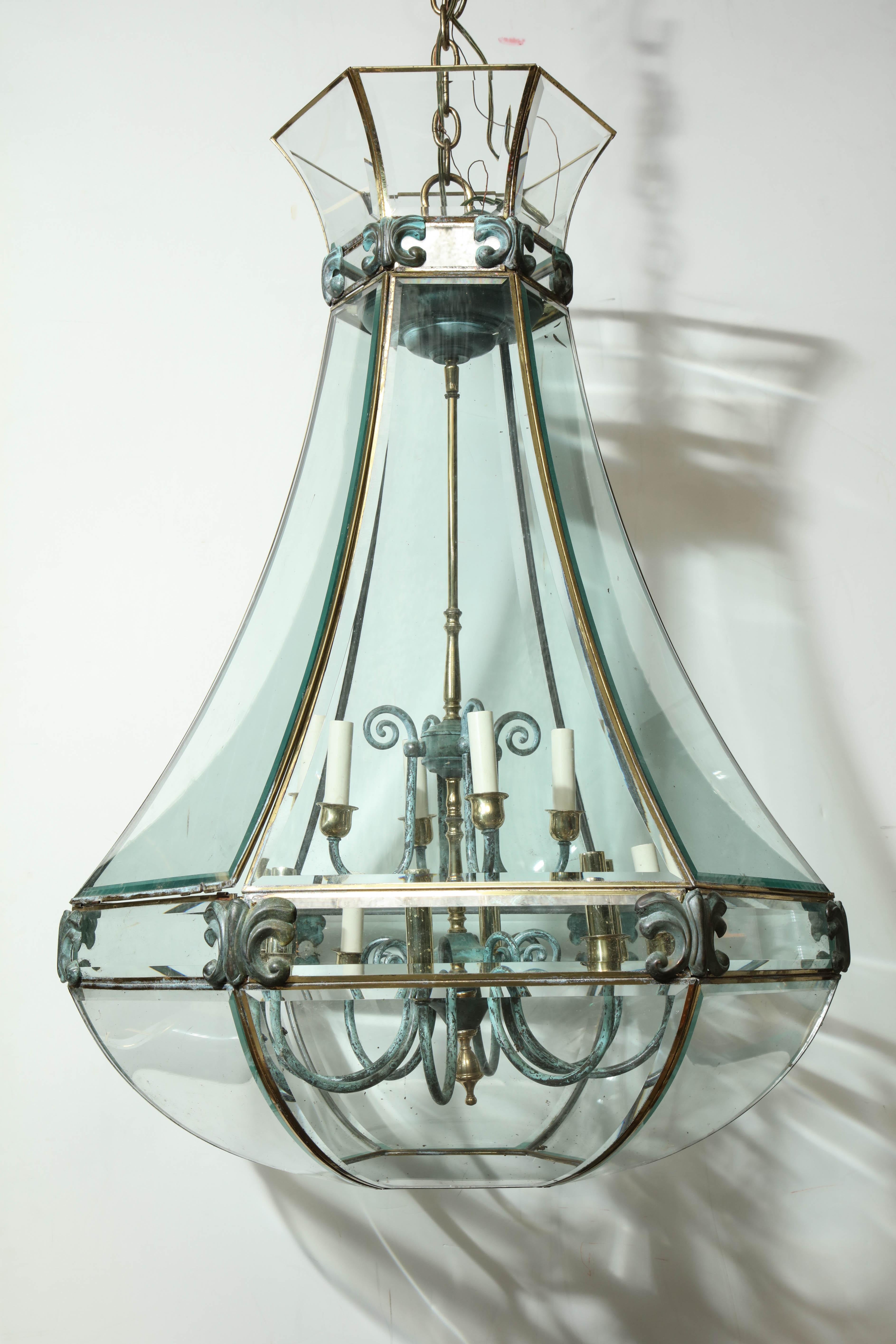 Hexagonal bevelled glass lantern with bronze trim.