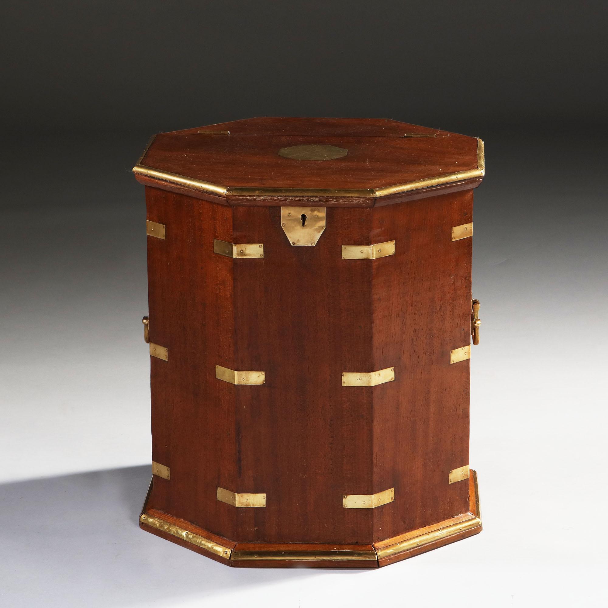 A fine late 19th century hexagonal mahogany Campaign box or occasional table, with brass mounts, handles to each side, and lifting lid.