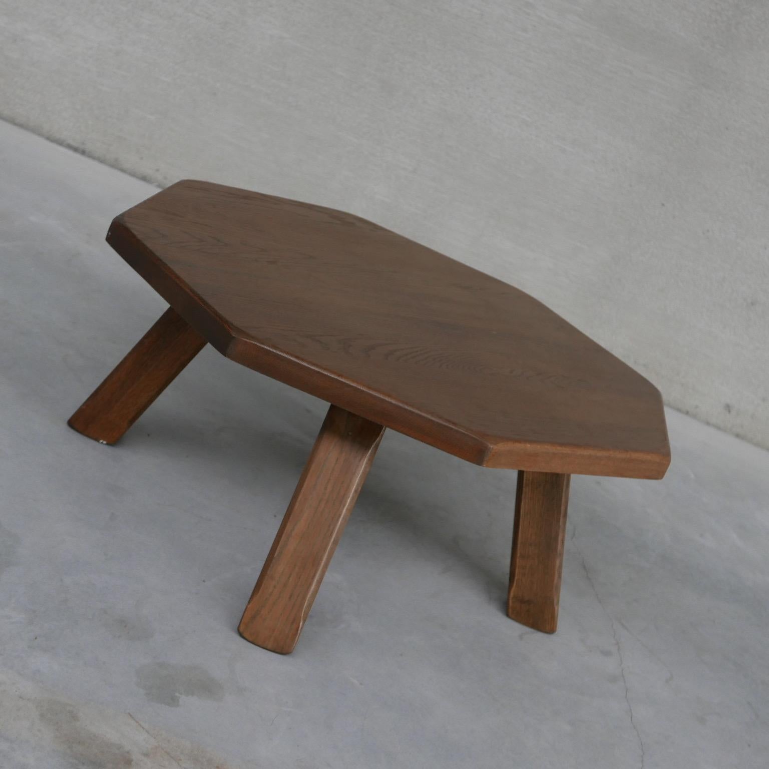 A mid-century almost brutalist style hexagonal coffee table. 

Belgium, c1960s. 

Raised over four thick legs. 

Good condition, the top can be lightly refinished upon request before delivery. 

Location: Belgium Location

Dimensions: 98 W