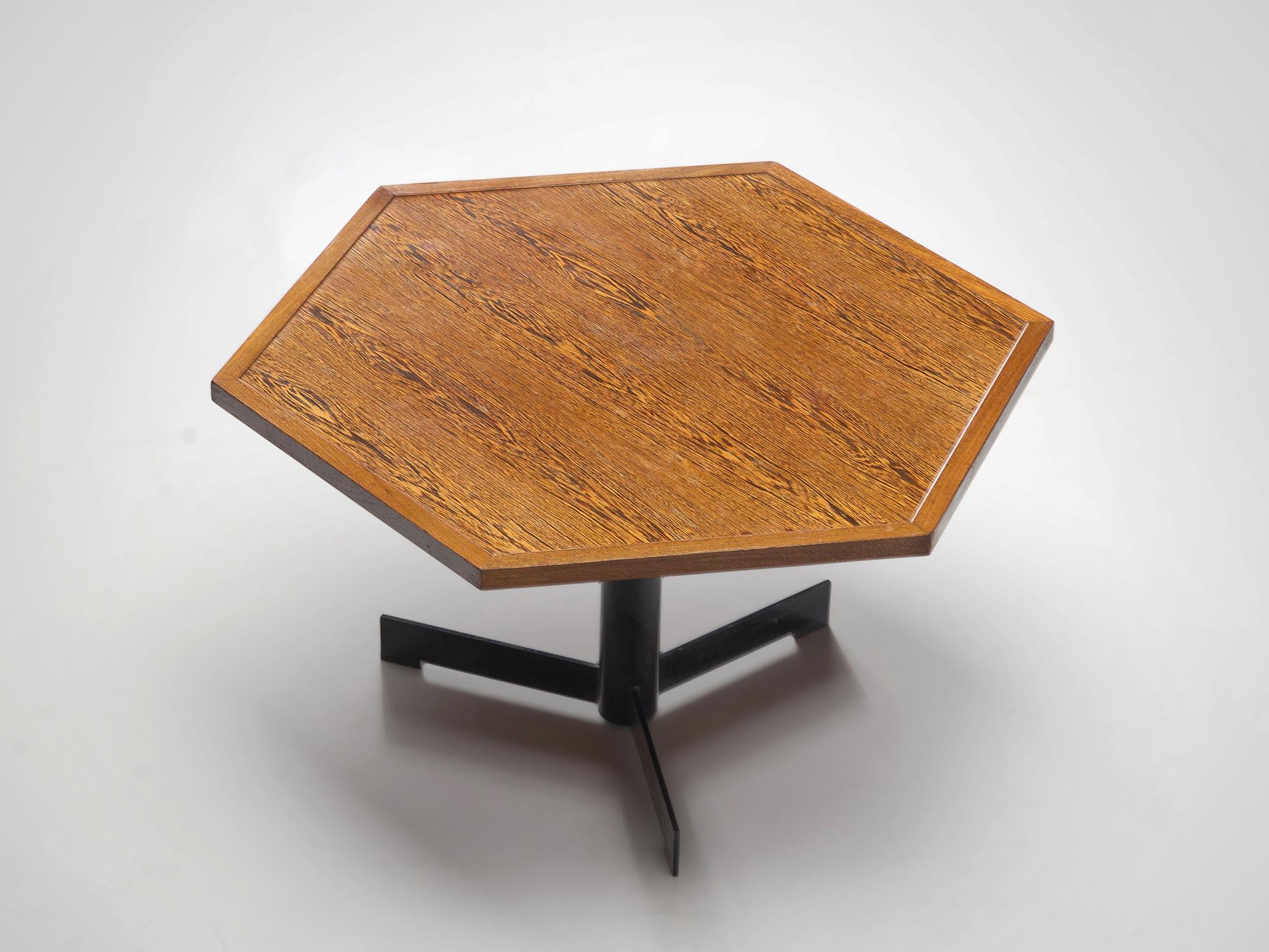 Dining table, wenge, steel, Belgium, circa 1960

This Belgium table features a hexagonal tabletop on a metal pedestal. The black pedestal consists out of a slim round base standing on three legs. With the veneered tabletop and the striped pattern