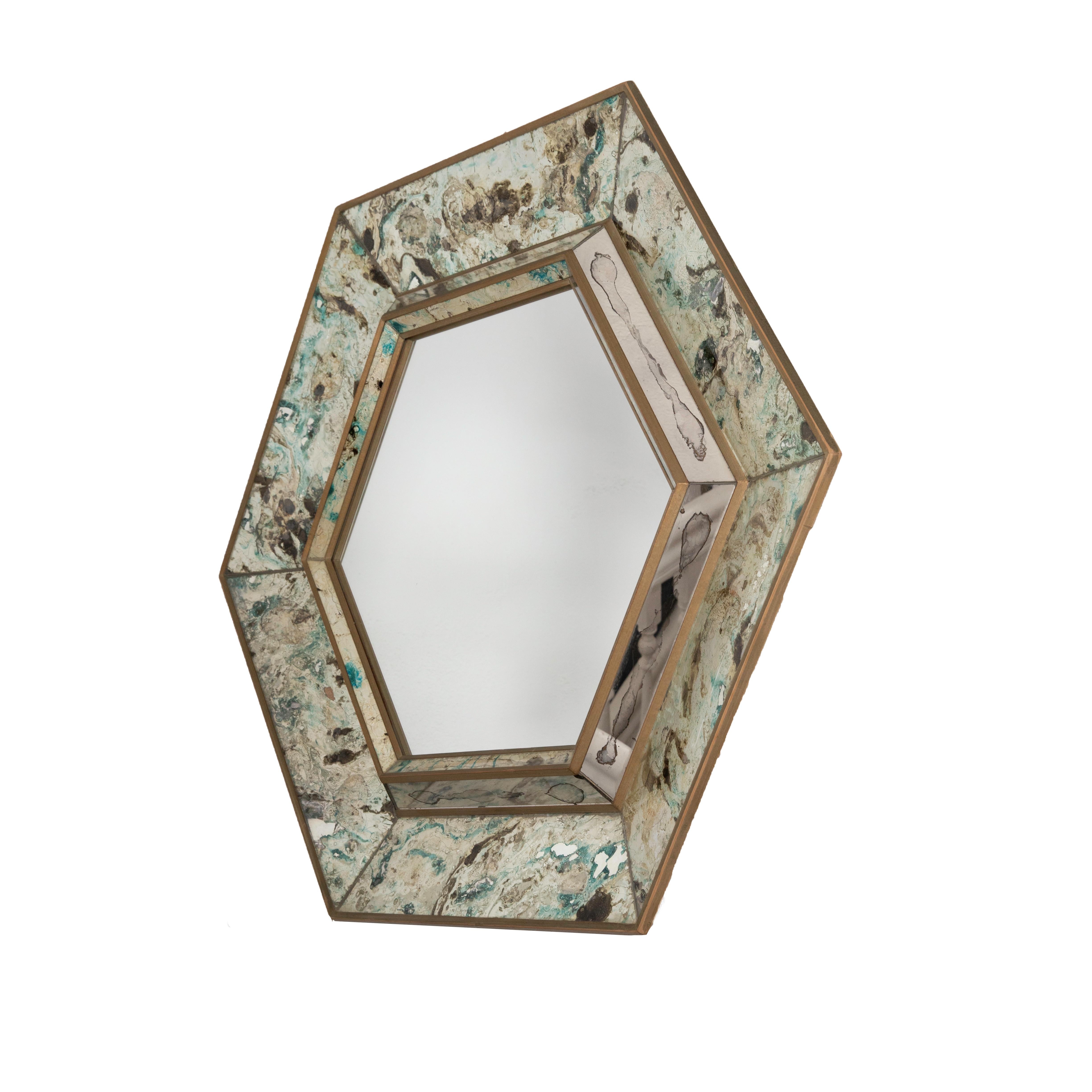 Hexagonal reverse painted mirror.
