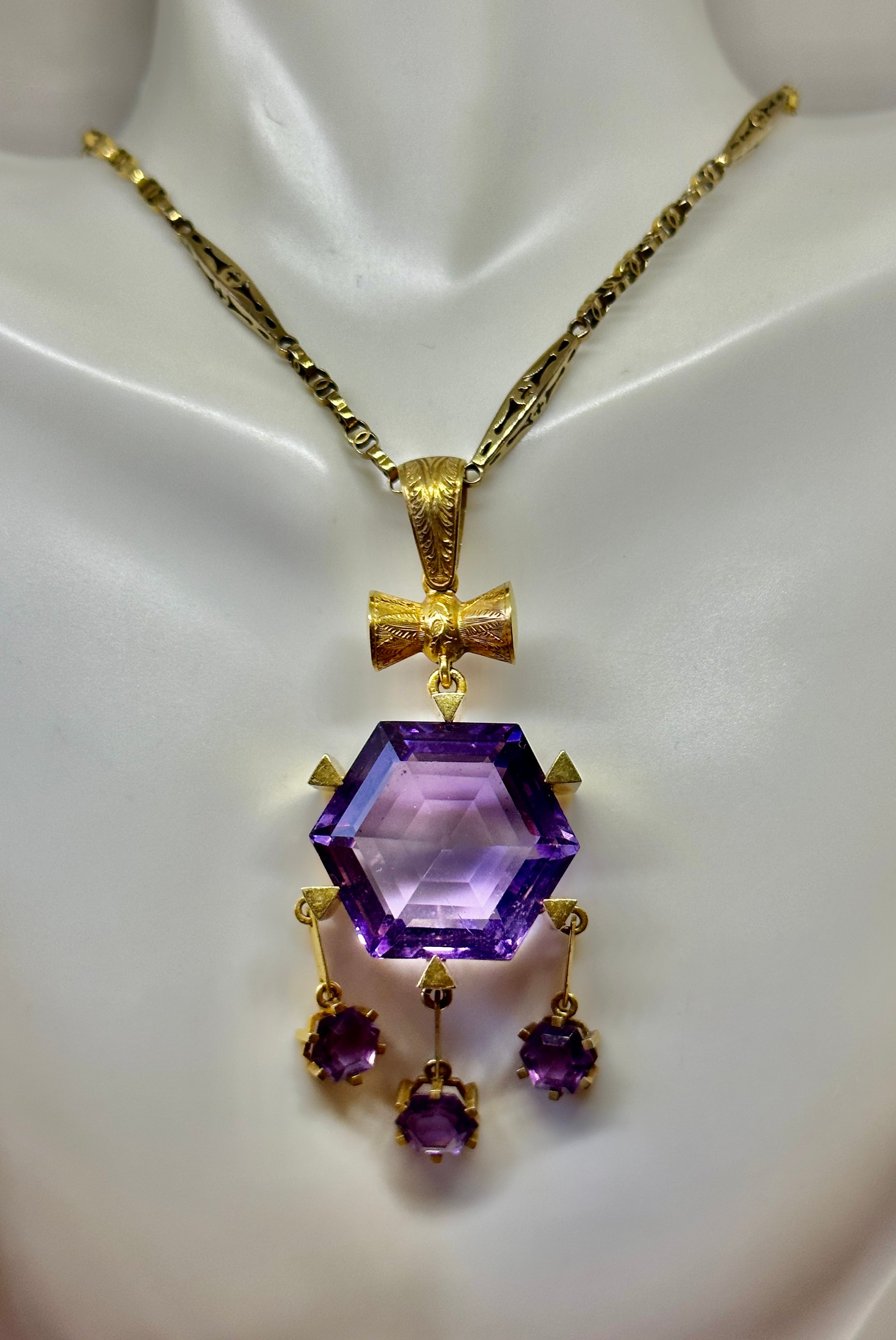 THIS IS A MAGNIFICENT MUSEUM QUALITY ANTIQUE VICTORIAN HEXAGONAL FACETED SIBERIAN AMETHYST PENDANT NECKLACE WITH THREE ADDITIONAL HEXAGONAL AMETHYST DROPS IN 14 KARAT GOLD.  THE PENDANT IS SIGNED AITCHISON AND IS THE WORK OF THE RENOWNED SCOTTISH