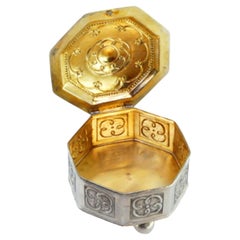 Hexagonal silver jewelry box with reliefs, gilt interior & three feet