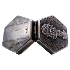 Hexagonal silver pill box with Aztec figure on the hinged lid