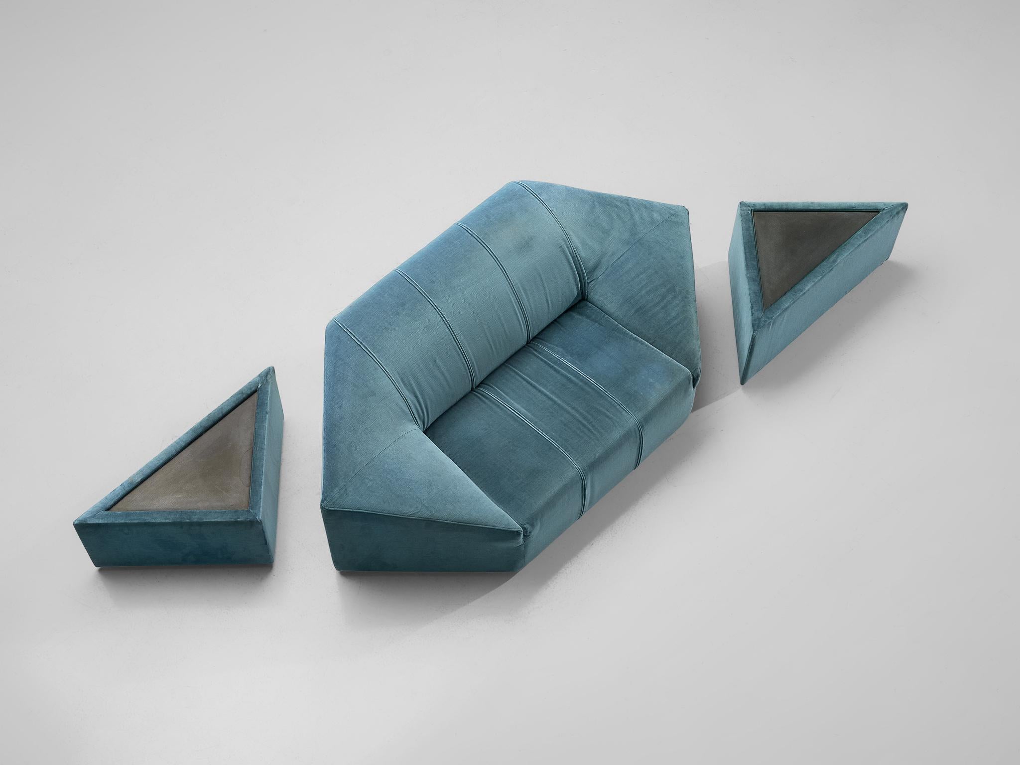Two-seat sofa with pair of side tables, aquamarine velour upholstery, Italy, 1960s.

Extravagant sofa in spectacular hexagonal shape. The Italian two-seat sofa has a solid base of which the backrest rises diagonally. This results in large and wide