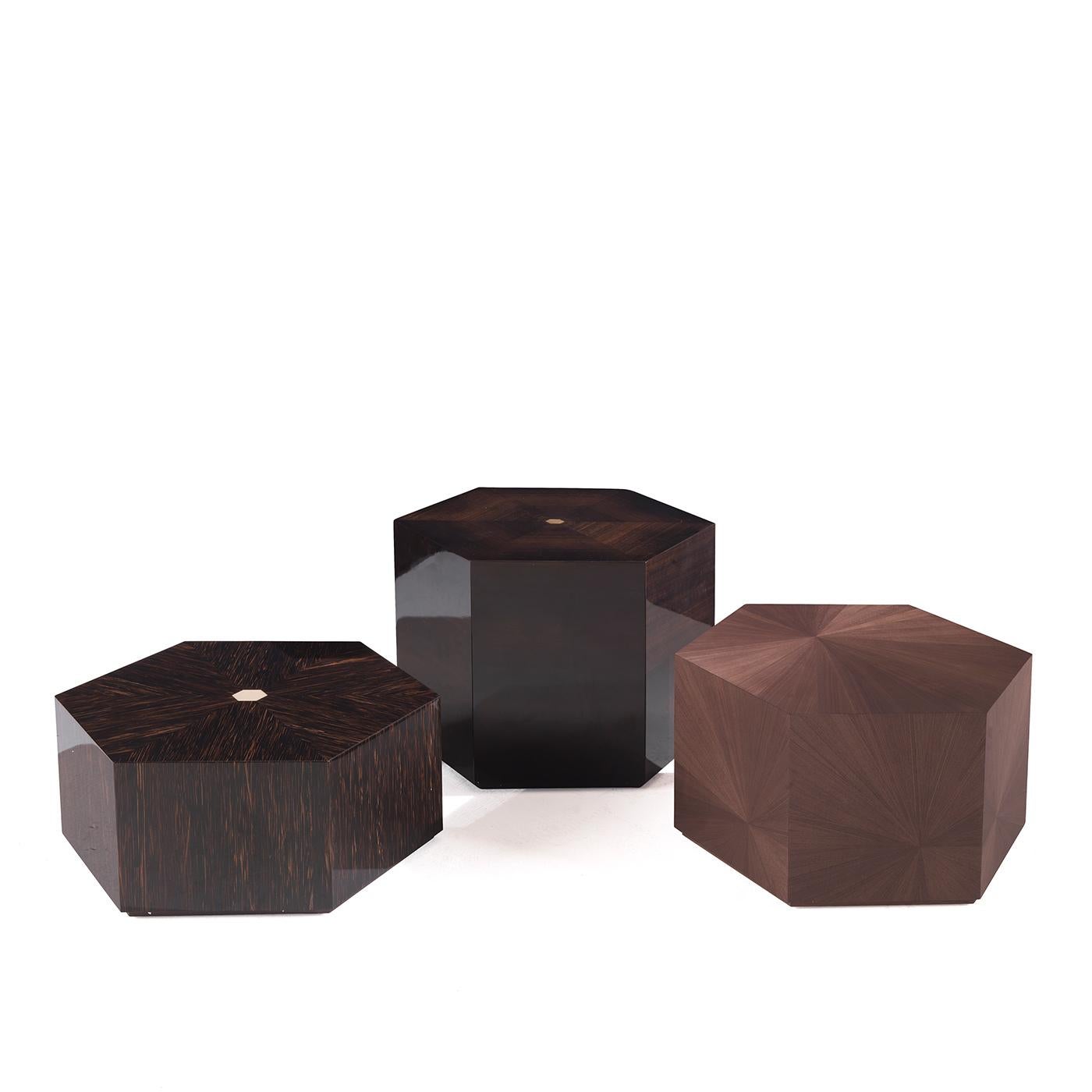 Subverting traditional design norms, this minimalist side table will add a bold touch to any interior with its distinctive design. The hexagonal frame is masterfully crafted of solid wood with eucalipto veneer. Versatile and bold, this piece can