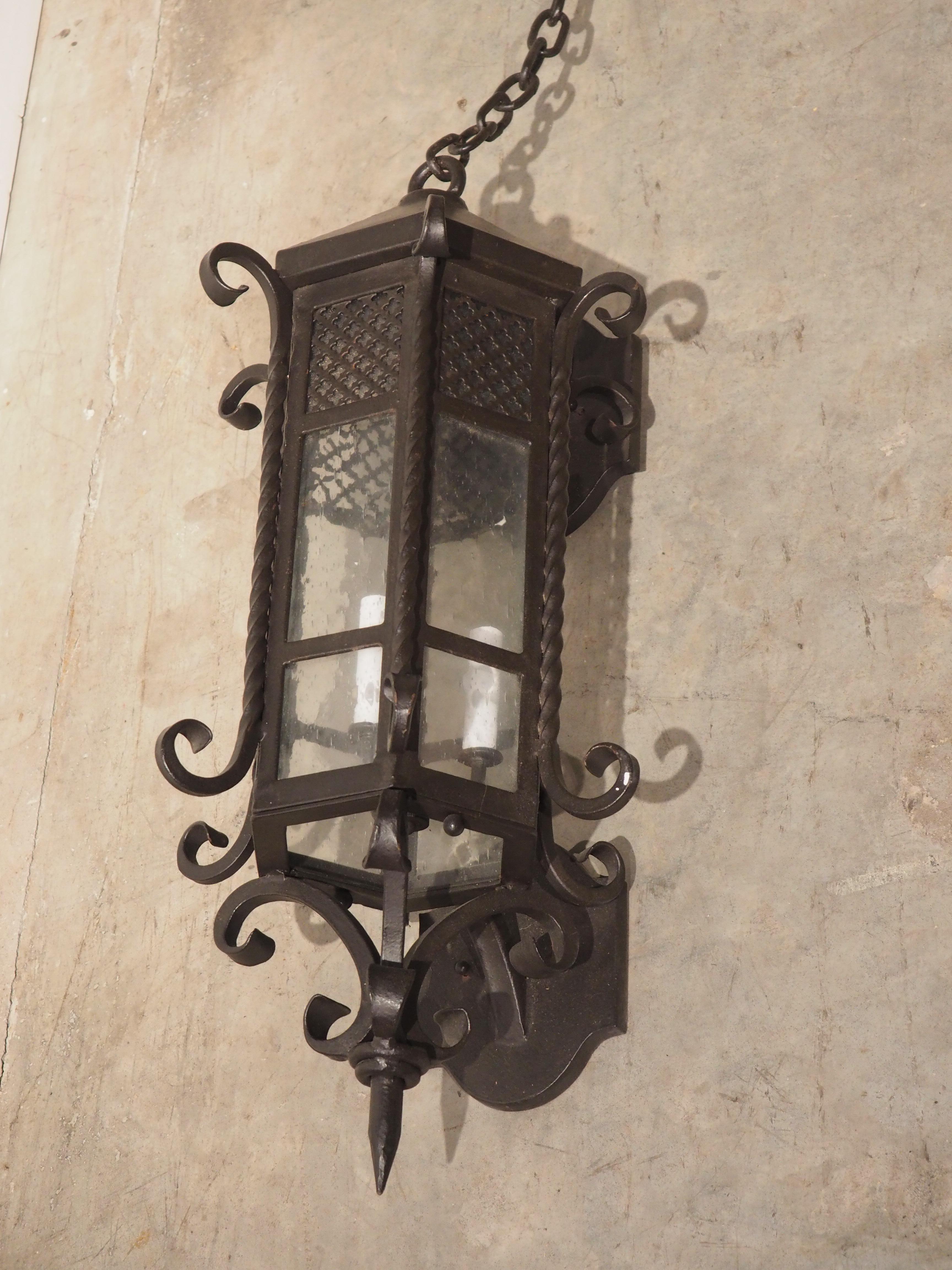 Hexagonal Wrought Iron Lantern with Chained Wall Mount In Good Condition In Dallas, TX